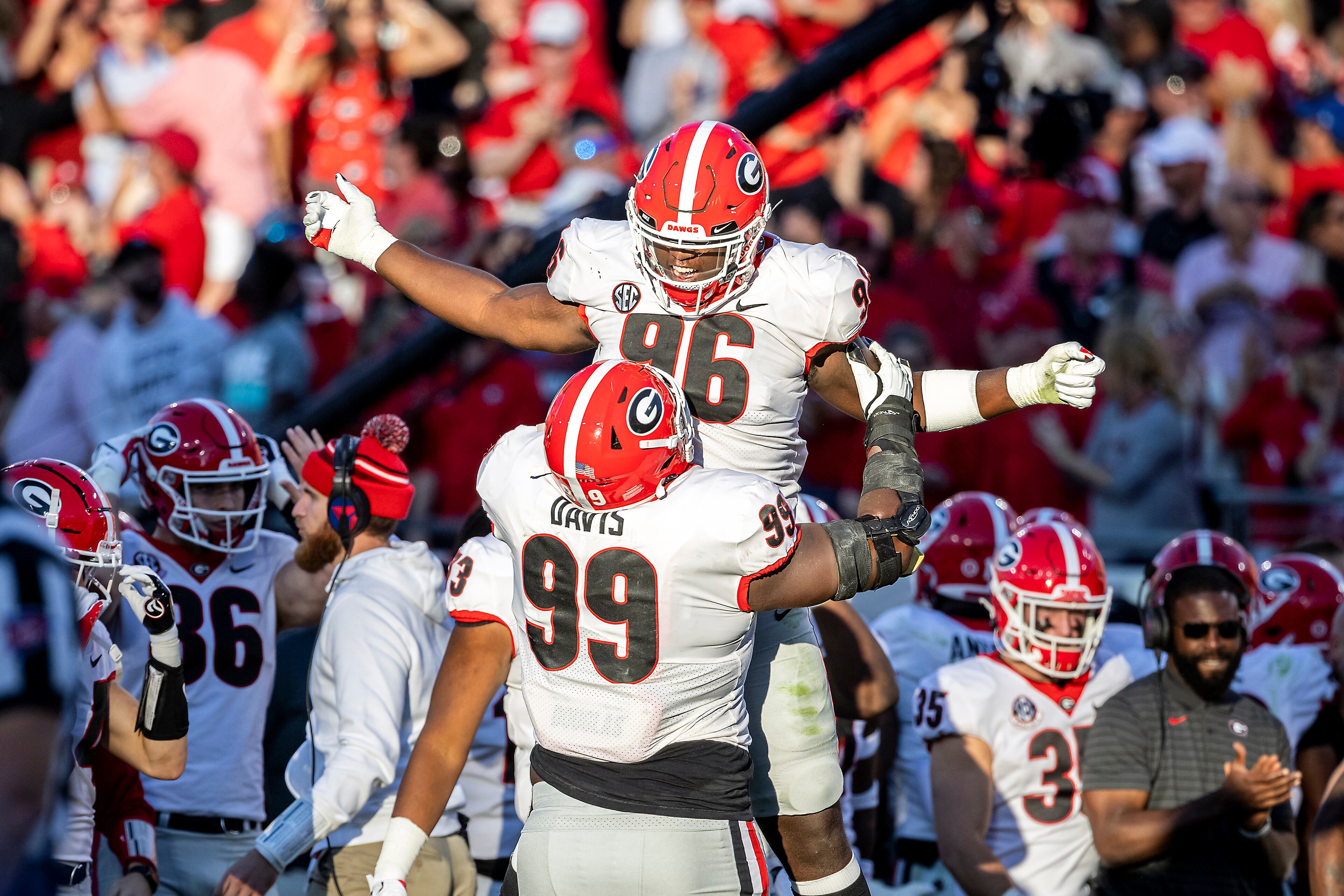 Georgia defensive lineman Zion Logue (96) and Georgia defensive lineman Jordan Davis (99) celebrate Florida’s missed field goal during the second half of an college football game, Saturday, Oct. 30, 2021, in Jacksonville, Fla. (Stephen B. Morton/Atlanta Journal-Constitution)