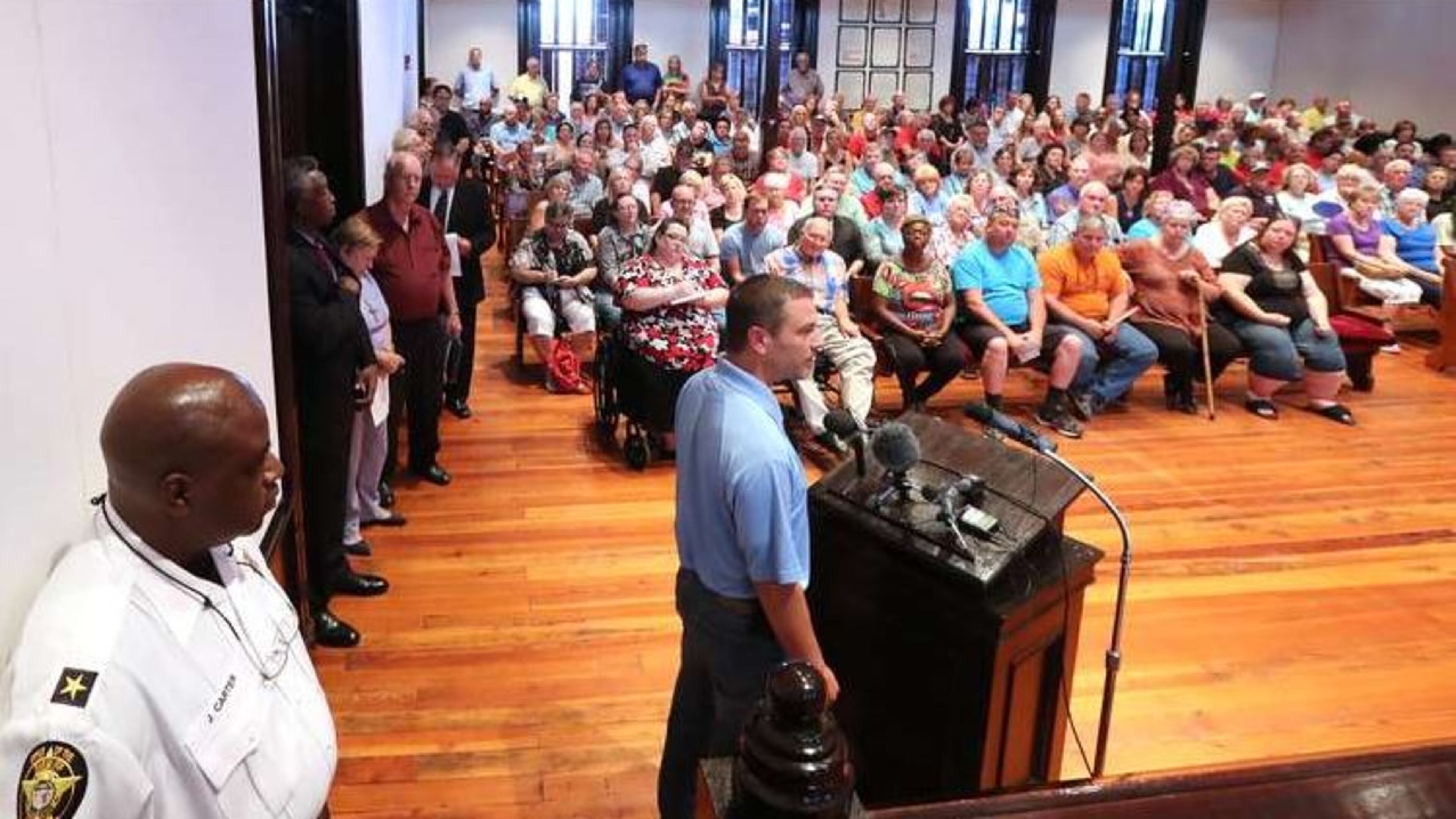 Residents attend a town hall meeting in Newton County to discuss plans to build a mosque and cemetery in the county on Monday in Covington. (AJC Photo / Curtis Compton)
