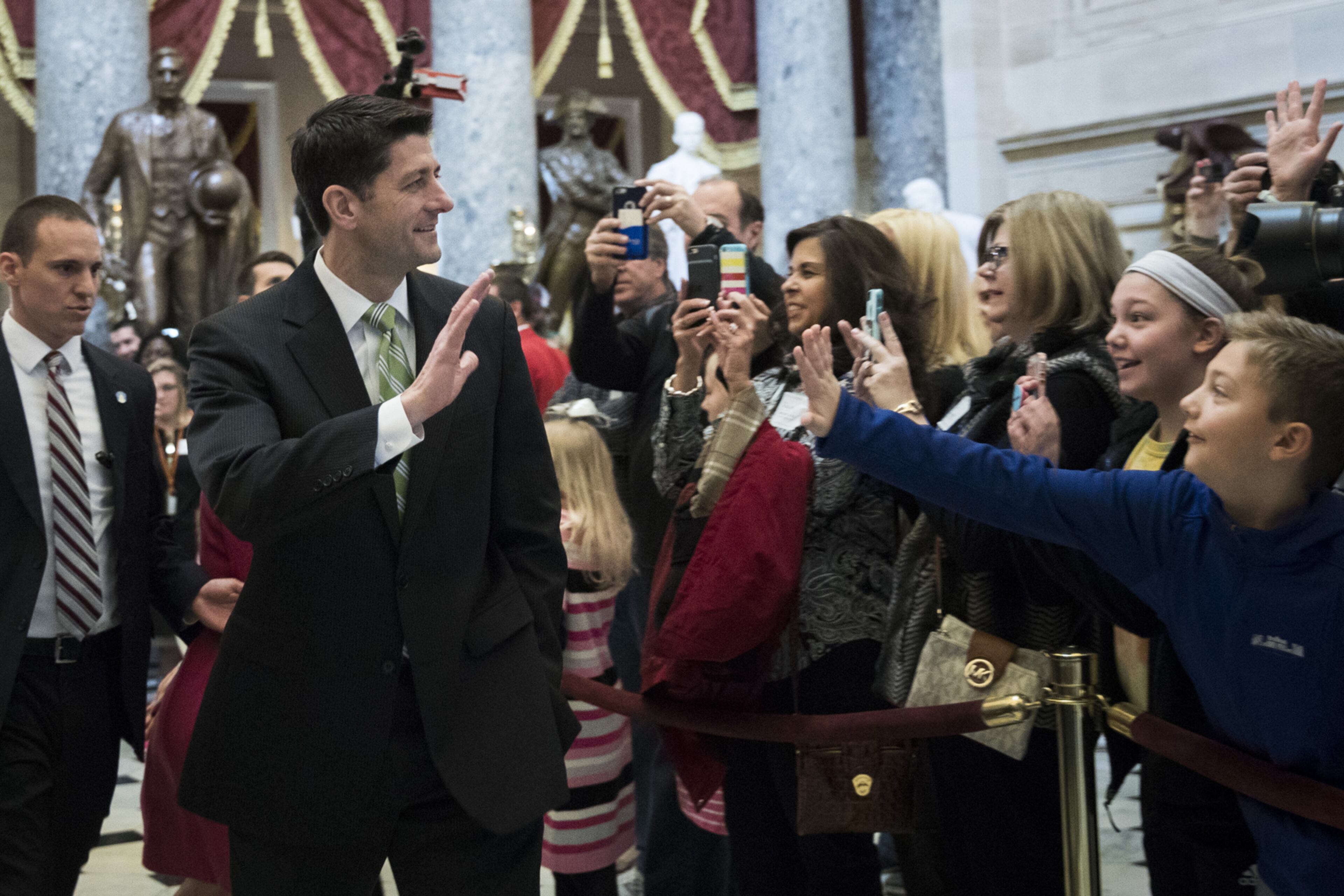 WASHINGTON, DC - MARCH 24: Speaker of the House Paul Ryan (R-WI) waves to tourists as he walks back to his office after a procedural vote relating to the American Health Care Act, on Capitol Hill, March 24, 2017 in Washington. House Republicans are planning for the final House vote on the American Health Care Act on Friday afternoon. (Photo by Drew Angerer/Getty Images)