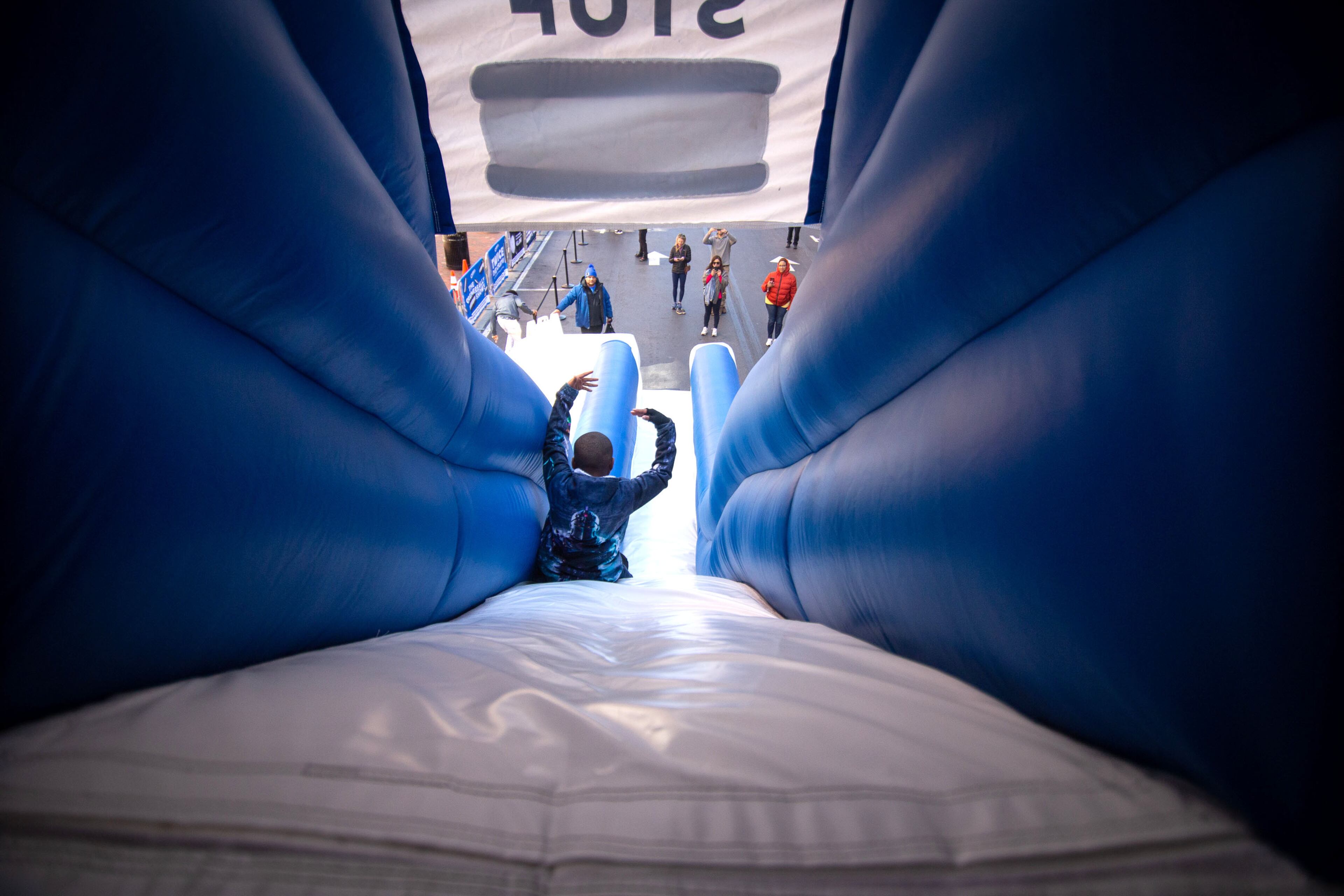 Kids slide down the giant Oreo cookie slide at Atlantic Station on Saturday, February 29, 2020. STEVE SCHAEFER / SPECIAL TO THE AJC