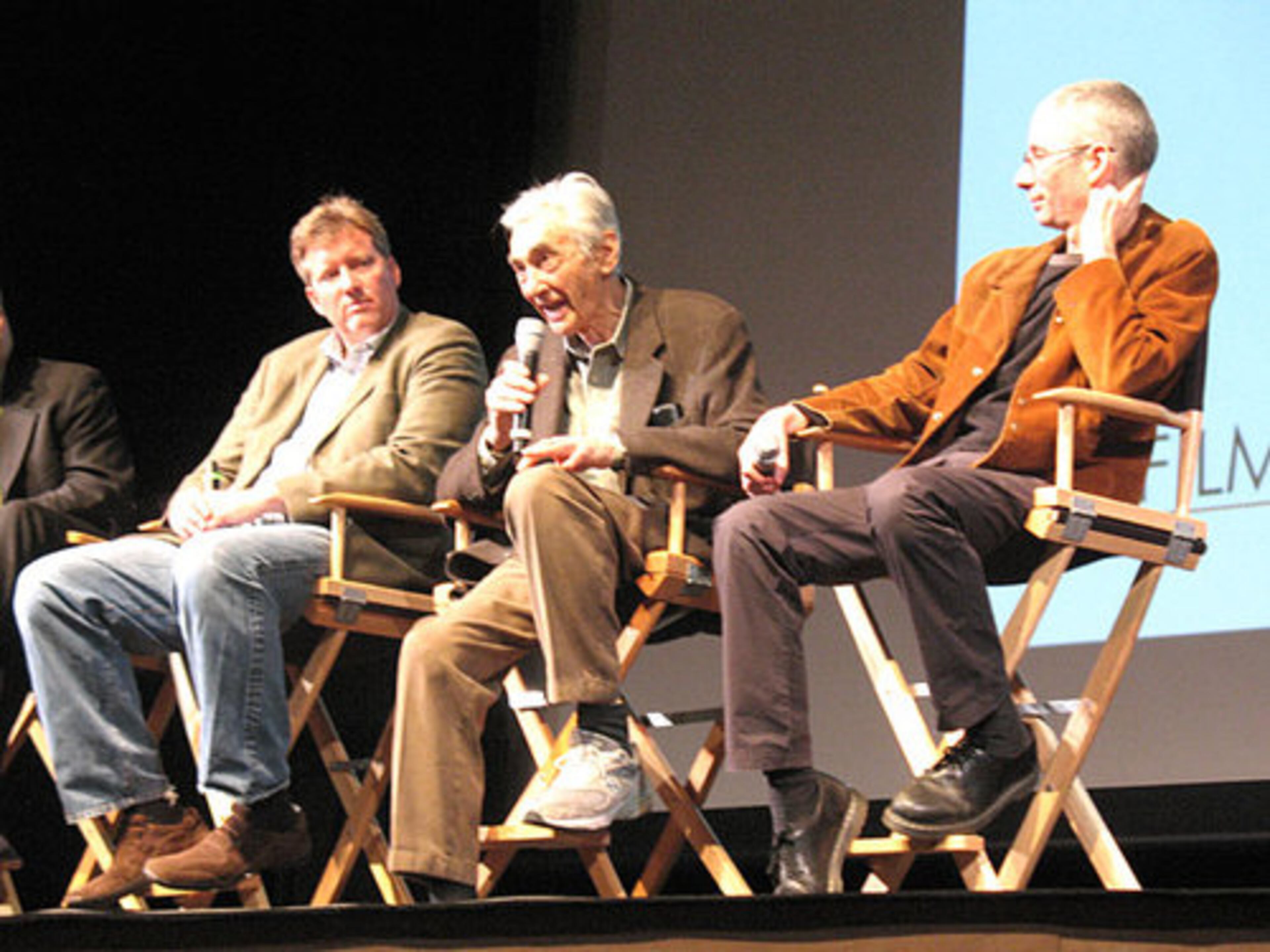 Film producers Chris Moore and Anthony Argove listen as author Howard Zinn (center), answers an audience question. "The People Speak" is based on Zinn's writings.