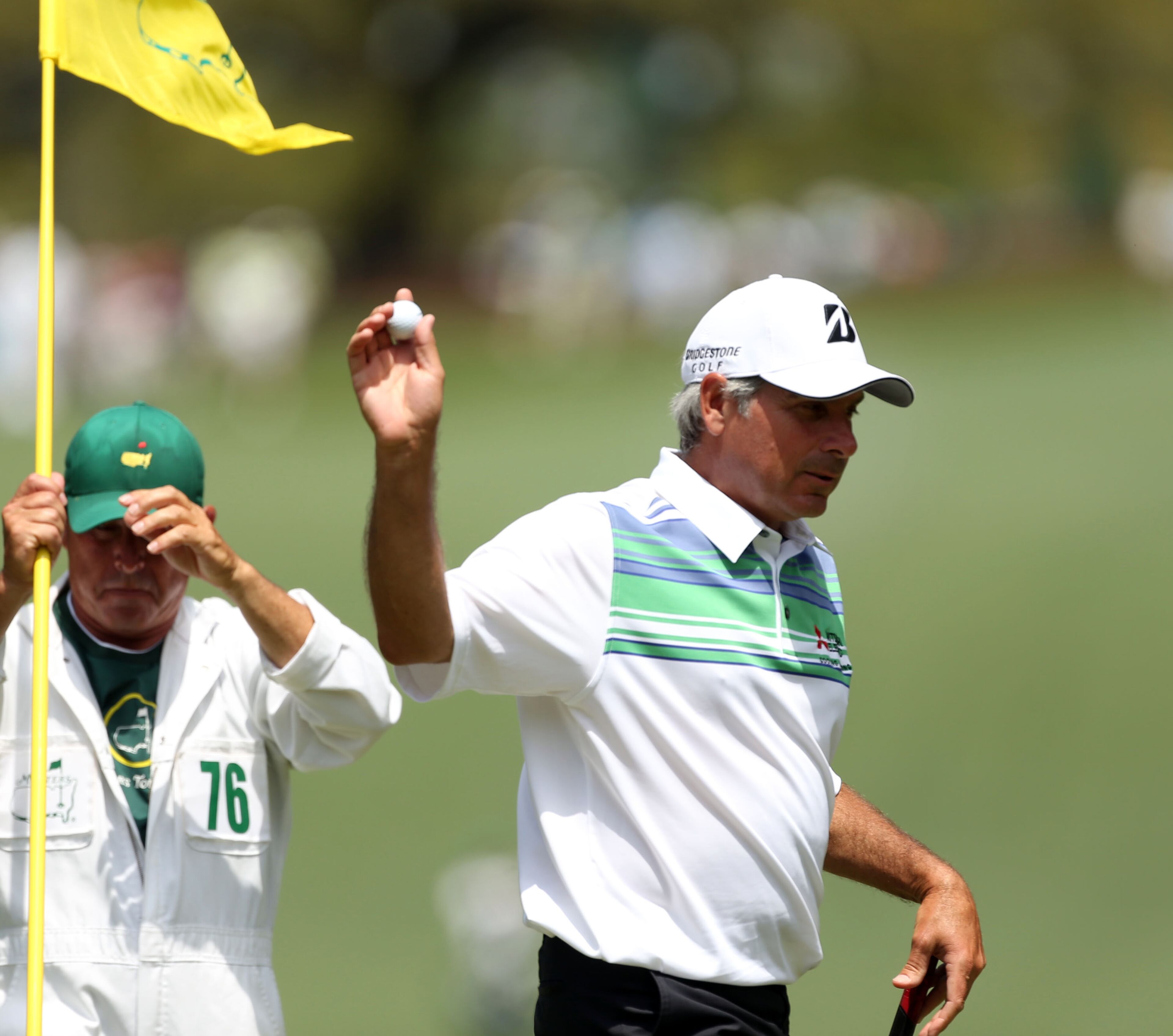 Fred Couples acknowledges the crowd after his shot on the #10 green during the second round in the Masters Tournament on Friday April 12 2013. JASON GETZ / JGETZ@AJC.COM