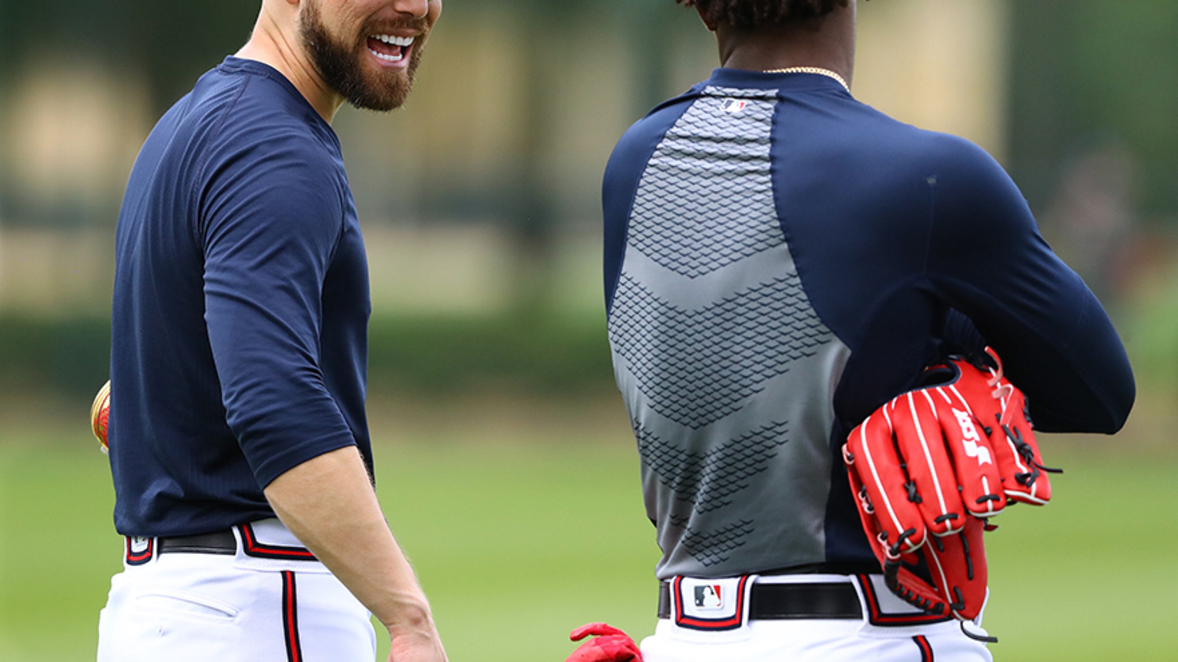 Atlanta Braves outfielder Ender Inciarte shares a laugh with Ronald Acuna while working in the outfield during spring training Wednesday, Feb. 20, 2019, at the ESPN Wide World of Sports Complex in Lake Buena Vista, Fla.