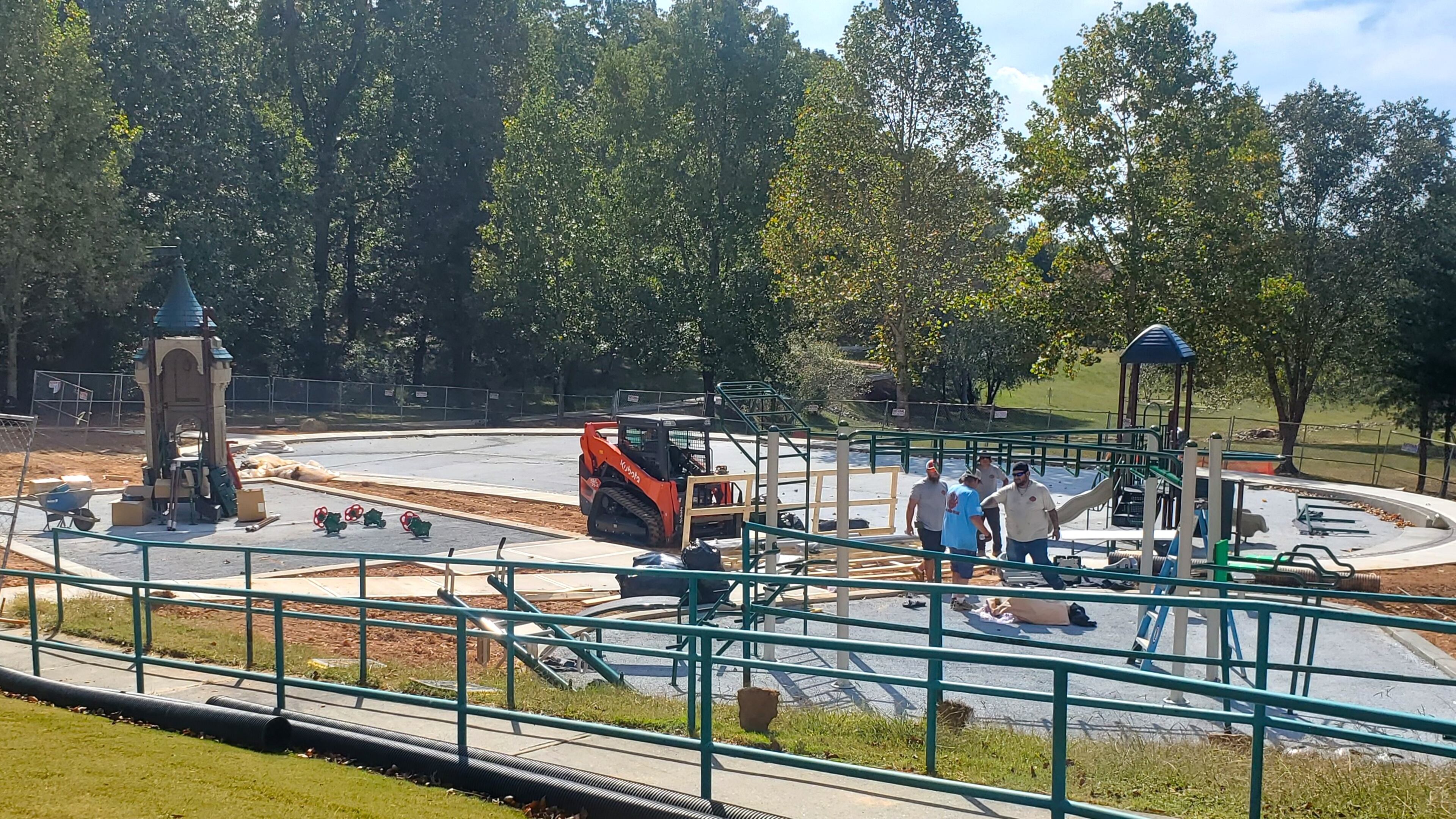 Construction workers in Dacula putting the finishing touches on the the Maple Creek Park playground. (Courtesy City of Dacula)
