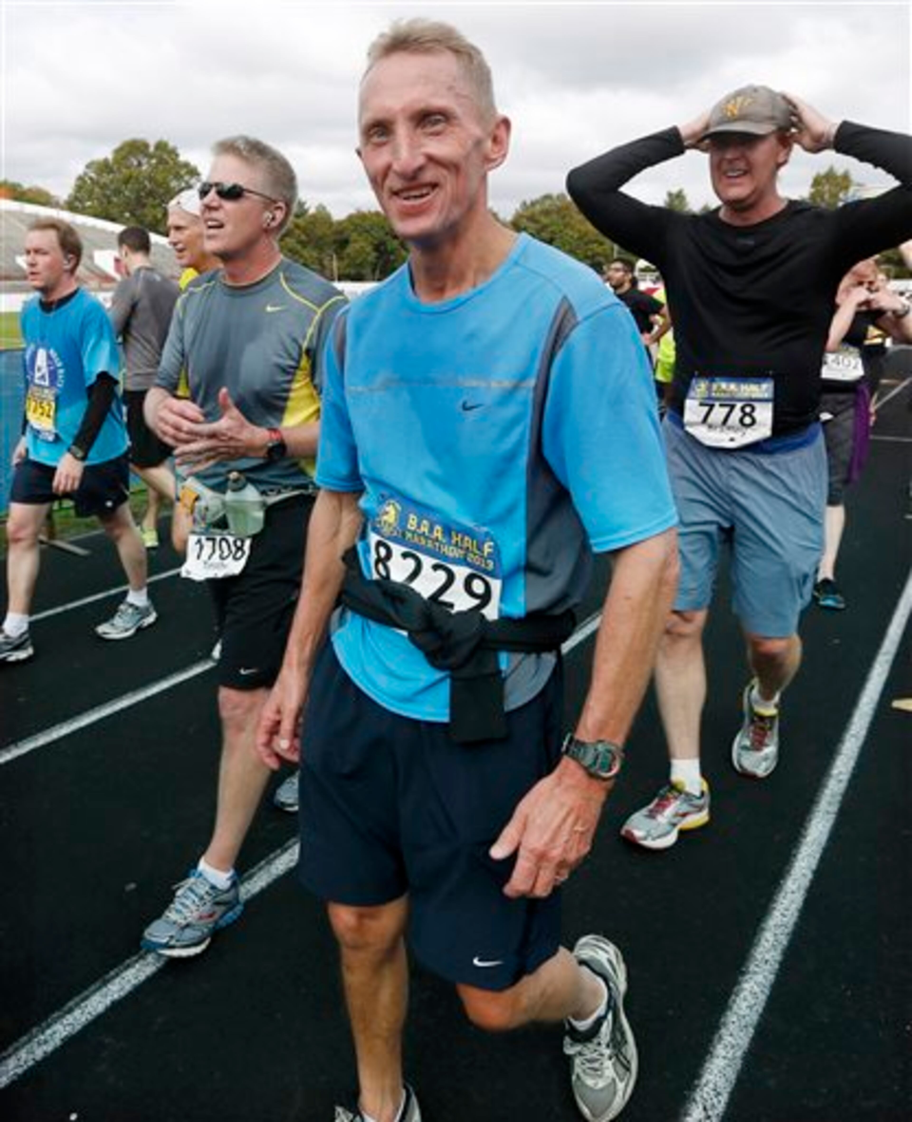 In this Oct. 13, 2013 photo, Boston Police Superintendent William Evans walks down the chute at the finish of the Boston Athletic Association half marathon in Boston. Evans has run the Boston Marathon 18 times, and finished in 2013 before the bombings occurred. This time he will be there as police commissioner, supervising increased security. "It weighs heavy on my mind, that I want this to go off well," he says. "I don�t want anyone hurt. I don�t ever want a repeat of the tragedy we saw that day." (AP Photo/Michael Dwyer)
