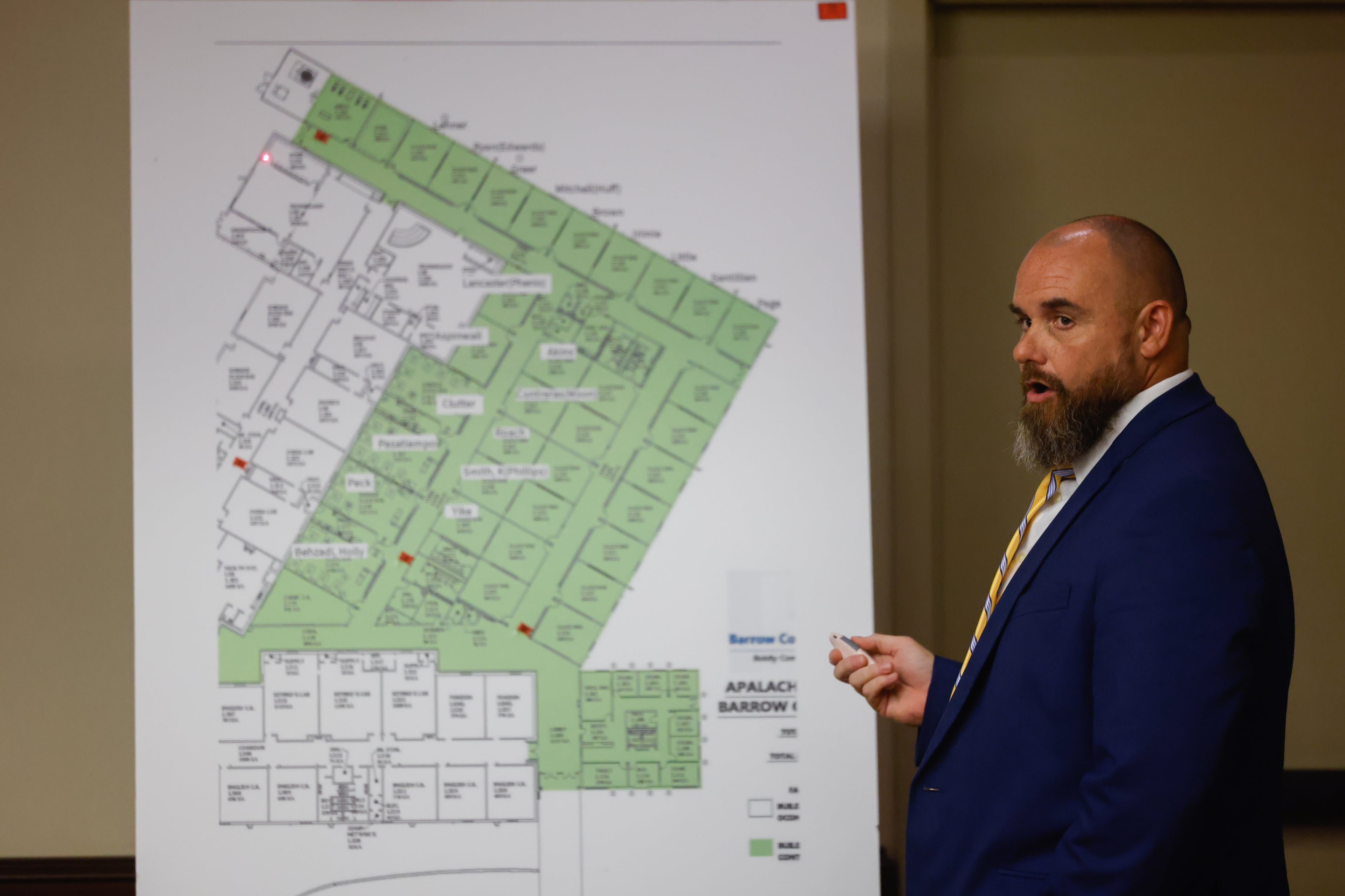 Jason Smith, a Barrow County Sheriff’s Office investigator, points at a map of Apalachee High School at the plea hearing of the 16-year-old Apalachee High School shooting suspect. (Arvin Temkar/AJC)