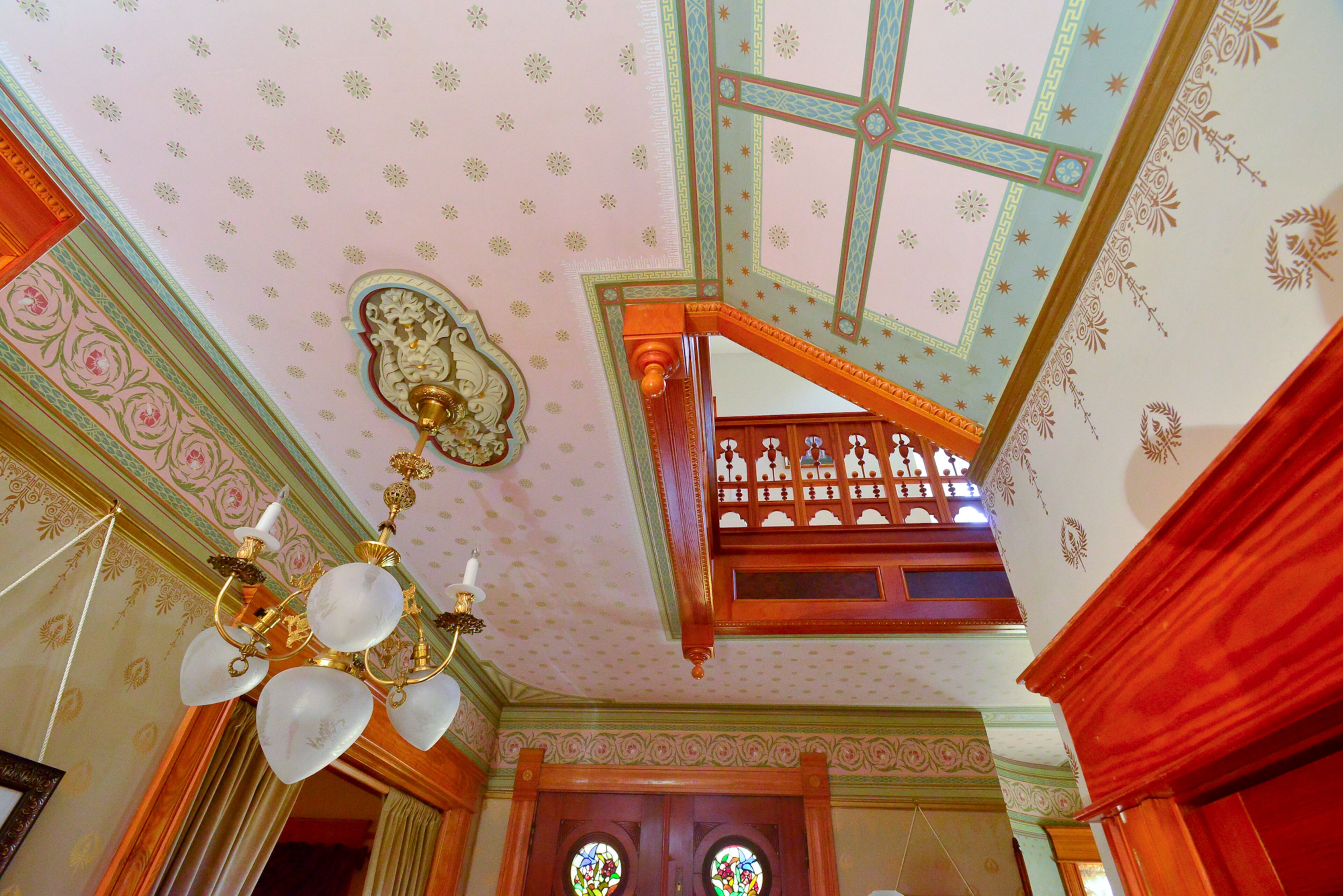 A signature feature in the foyer is the use of wallpaper all the way up to the ceiling, which was added in 2004. The couple went to the Bradbury & Bradbury factory in California to select the hand-screened wallpaper, which was a splurge. Several different layers are used for the upper and bottom portions of the walls. "That would have been typical for your upper class homes to have the very fancy wallpaper," Carolyn said.