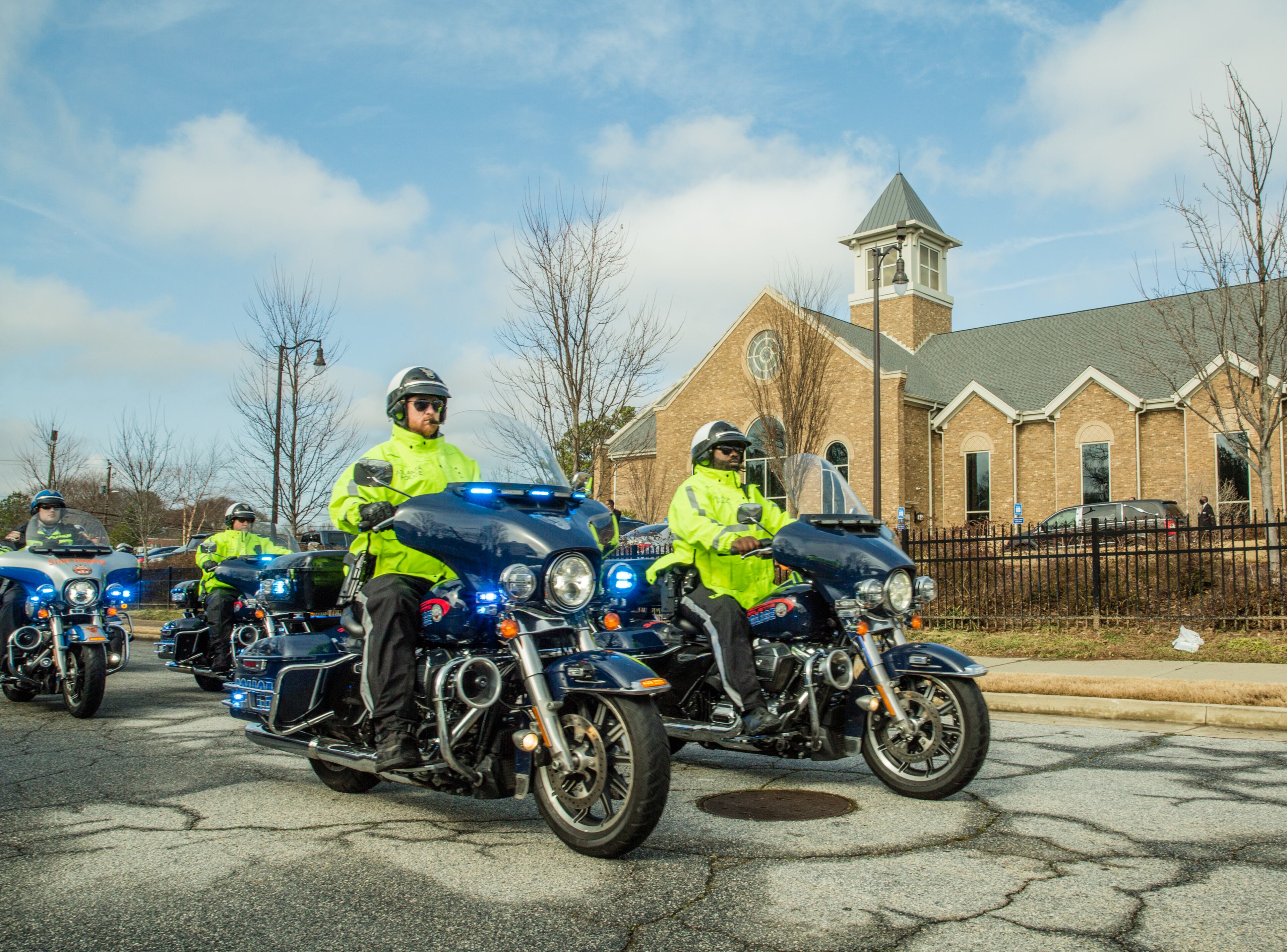 The Atlanta Police department leads mourners as they begin to pay respect to baseball legend Hank Aaron at his funeral Wednesday, Jan 27, 2021 at Friendship Baptist Church in Atlanta. (Jenni Girtman for The Atlanta Journal-Constitution)
