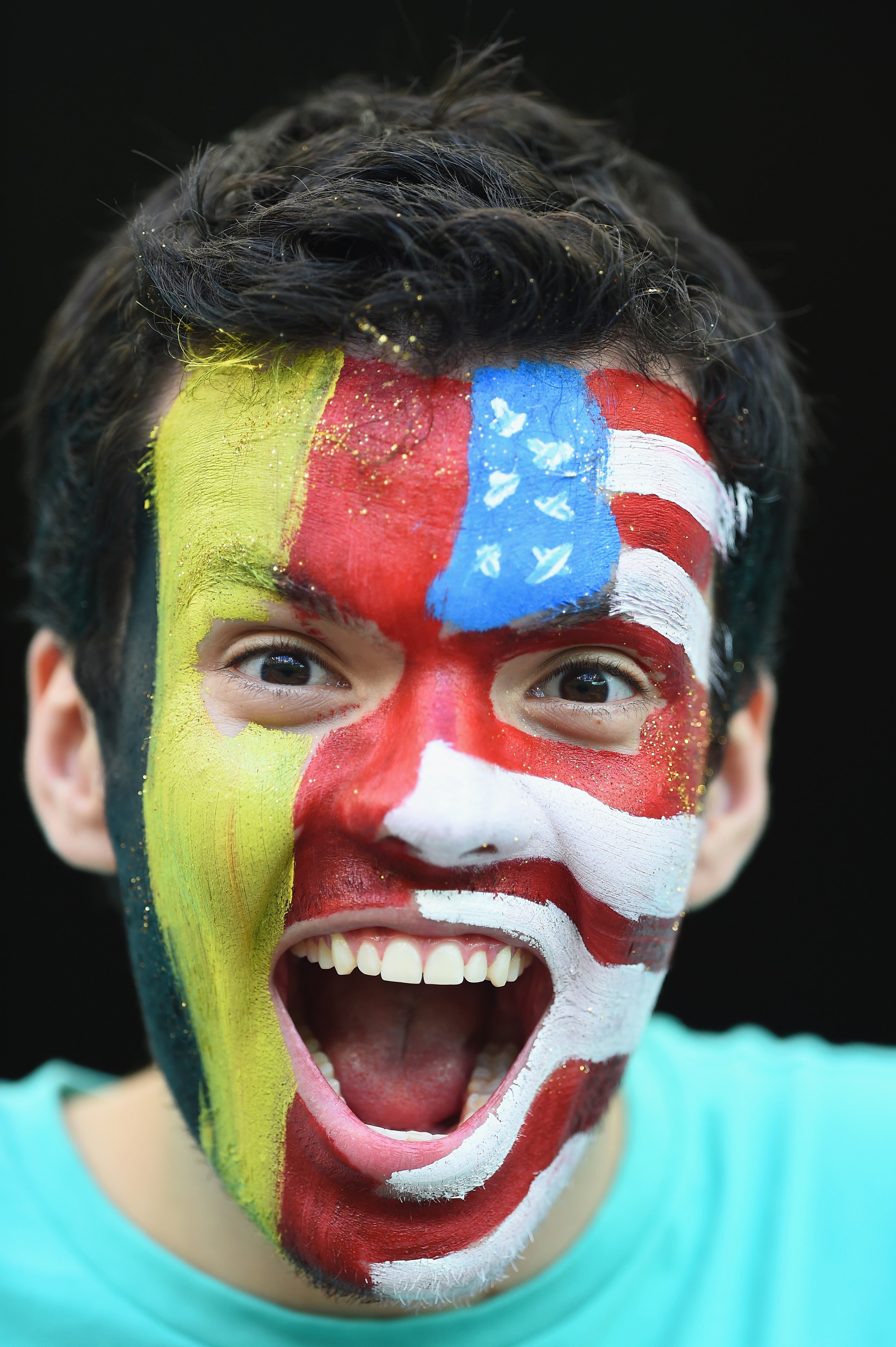 SALVADOR, BRAZIL - JULY 01: A fan smiles ahead of the 2014 FIFA World Cup Brazil Round of 16 match between Belgium and the United States at Arena Fonte Nova on July 1, 2014 in Salvador, Brazil. (Photo by Laurence Griffiths/Getty Images)