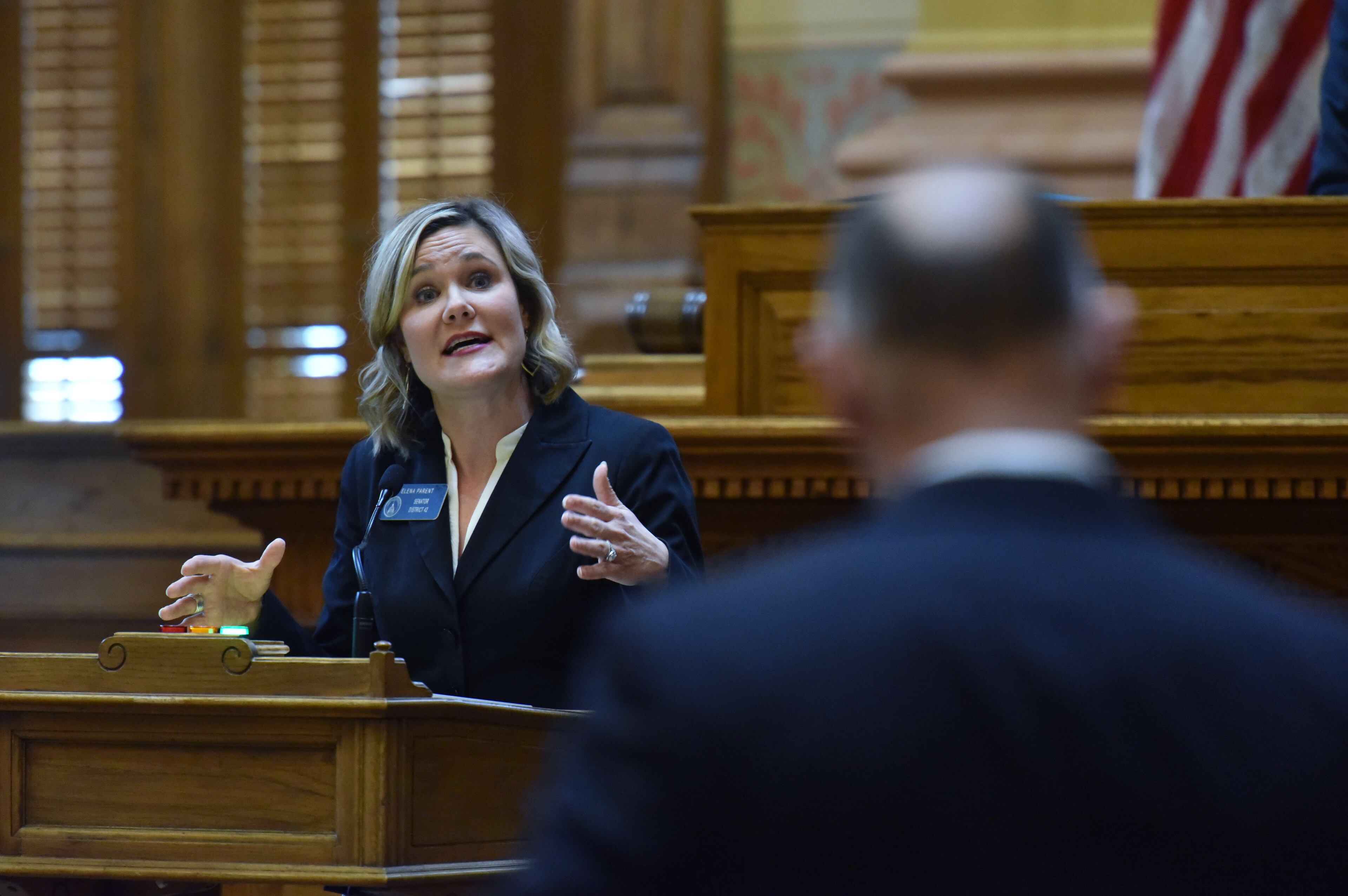March 7, 2019 Atlanta - Senator Elena Parent answers to Senator Randy Robertson (foreground) before the senate votes on SB 163, which is "Equal Opportunity for Access in Education Act", in the Senator Chambers during Crossover day at the Capitol on Thursday, March 7, 2019. Hundreds of bills hang in the balance at the Georgia Capitol on Thursday, the self-imposed deadline for legislation to pass at least one chamber. Dozens of bills ranging from the hotly contested to the mundane will be debated on Crossover Day, which occurs on the 28th business day of each yearâs 40-day legislative session. HYOSUB SHIN / HSHIN@AJC.COM