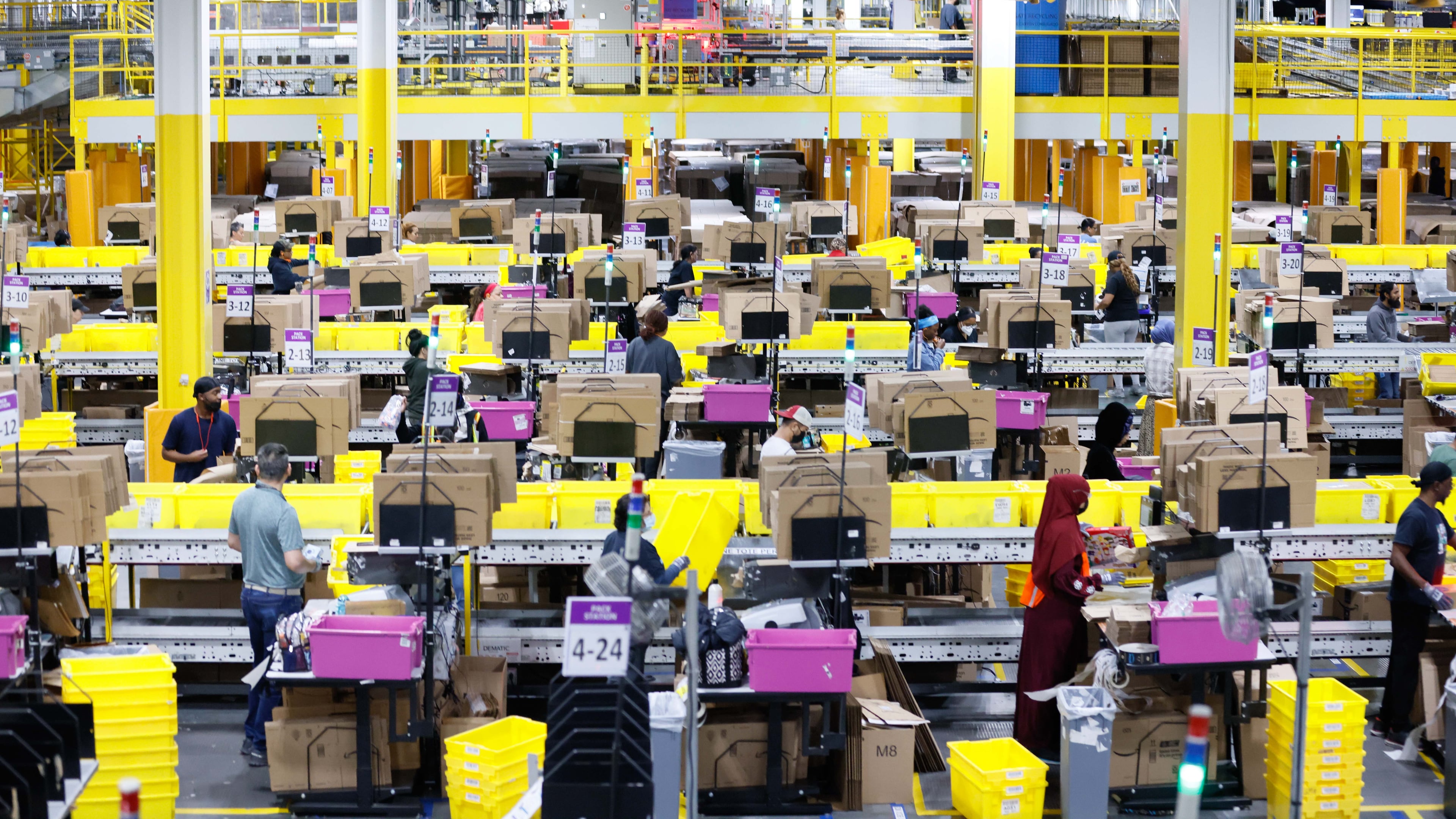 Dozens of Amazon employees work at the Single Pack Station, where packages are prepared for delivery on Monday, December 2, 2024, at the Amazon distribution center in Stone Mountain, where hundreds of thousands of orders were fulfilled on Cyber Monday.
(Miguel Martinez / AJC)