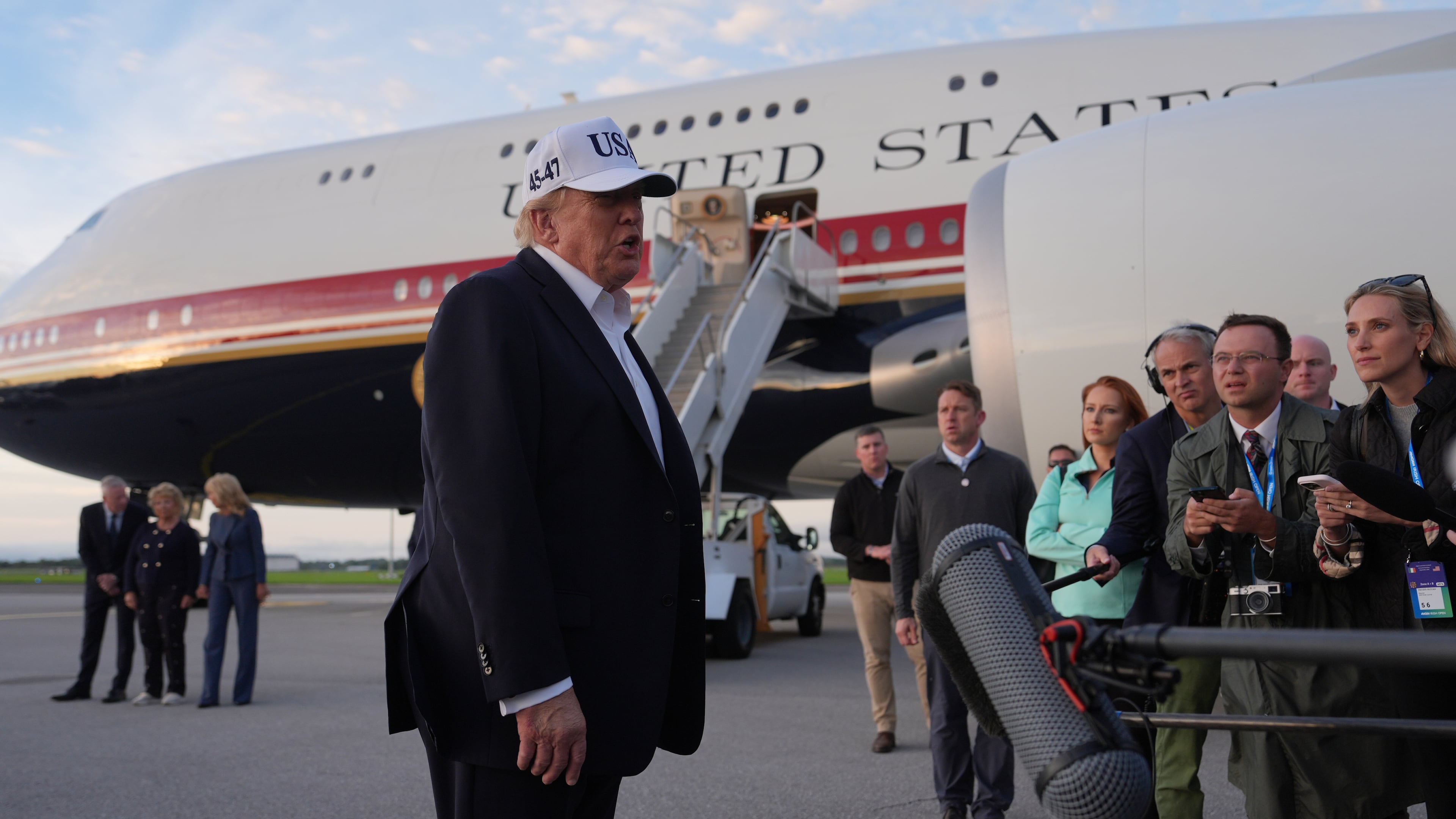 U.S. President Donald Trump speaks with journalists prior to boarding Air Force One at Shannon Airport in Shannon, Ireland, Sunday, Sept. 13, 2026. (AP Photo/Julia Demaree Nikhinson)