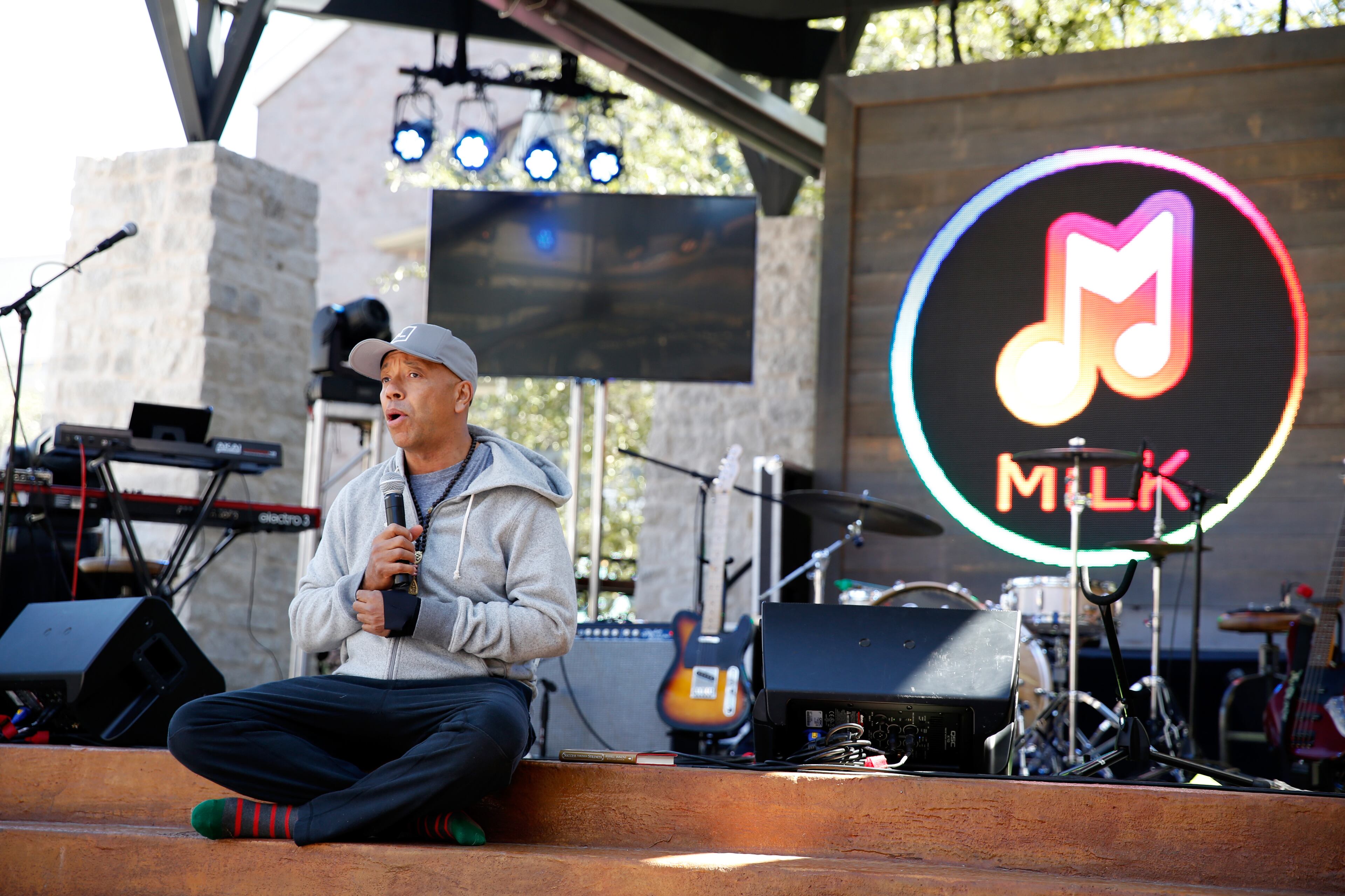 AUSTIN, TX - MARCH 12: Founder All Def Music Russell Simmons participates in yoga before the ADD52 music showcase during day 5 of The Samsung Galaxy Experience at SXSW 2014 on March 12, 2014 in Austin, Texas. (Photo by Rick Kern/Getty Images for Samsung)
