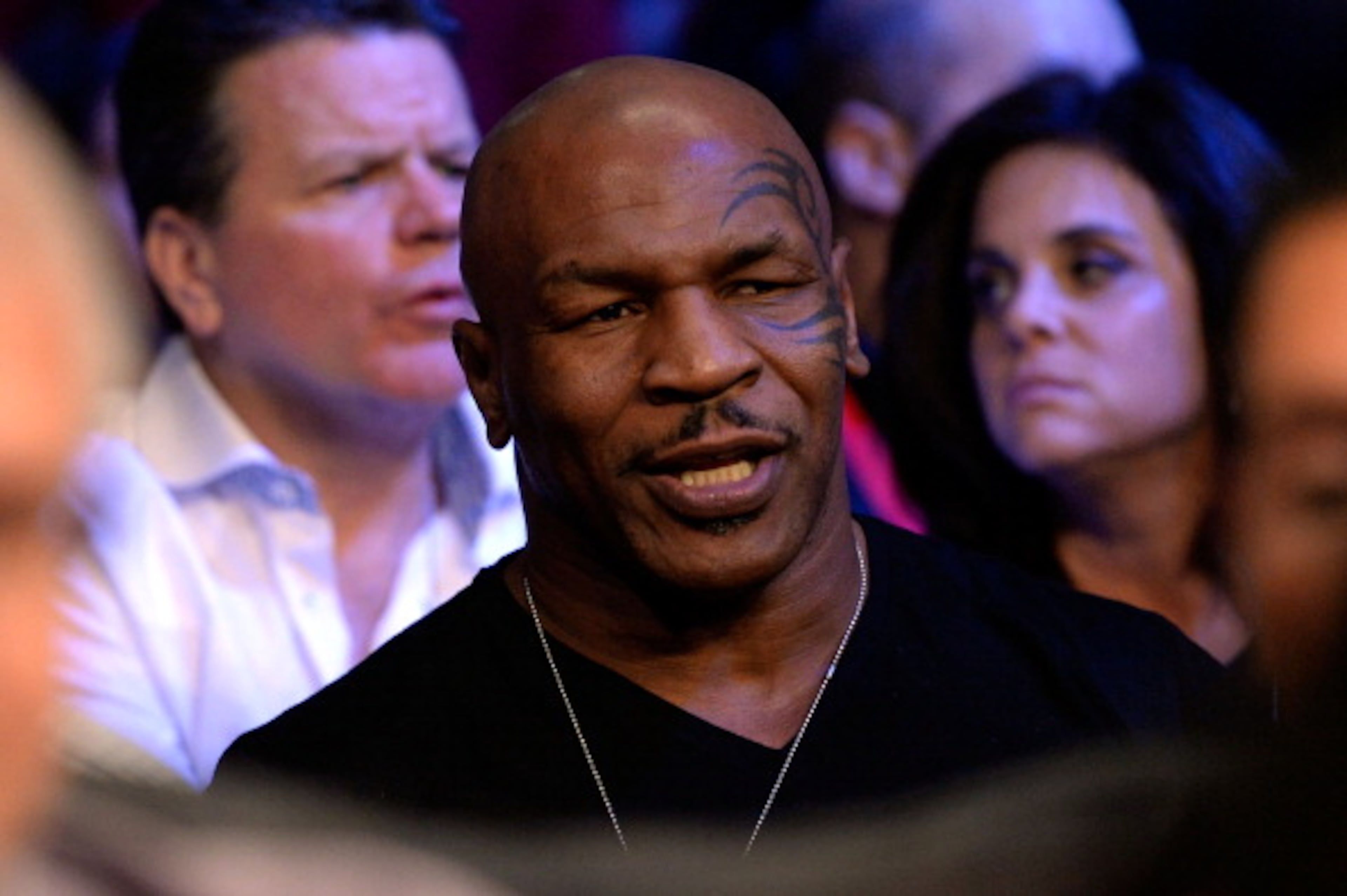 LAS VEGAS, NV - OCTOBER 12: Former boxer Mike Tyson sits in the stands as he watches Orlando Cruz fight Orlando Salido (both not pictured) during their WBO featherweight championship bout at the Thomas & Mack Center on October 12, 2013 in Las Vegas, Nevada. (Photo by Jeff Bottari/Getty Images)
