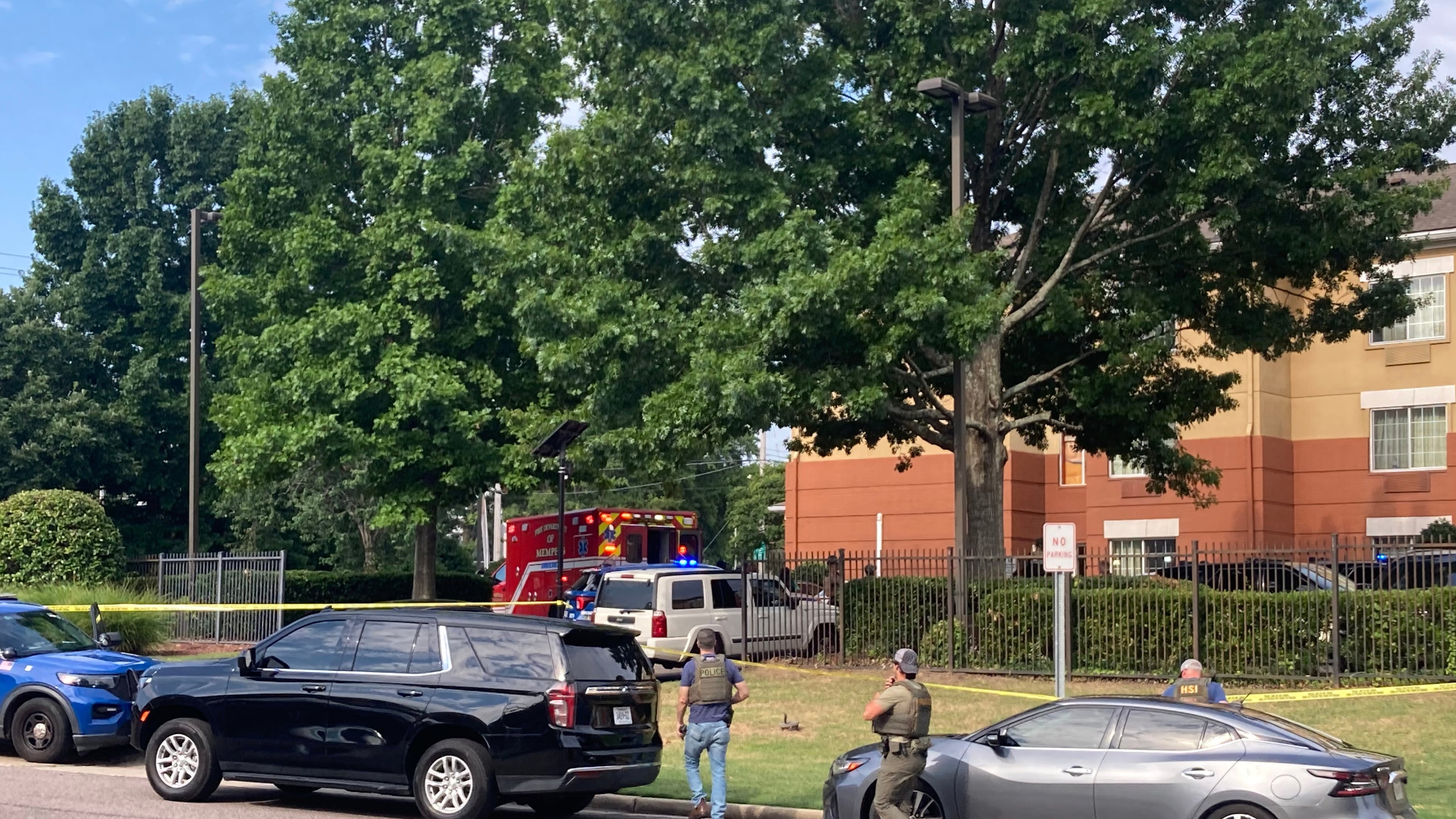 Law enforcement officers work the scene after a federal agent with the Memphis Safe Task Force shot and killed a person at a hotel in Memphis, Tenn., on Wednesday, July 8, 2026. (Natalie Van Gundy/Daily Memphian via AP)