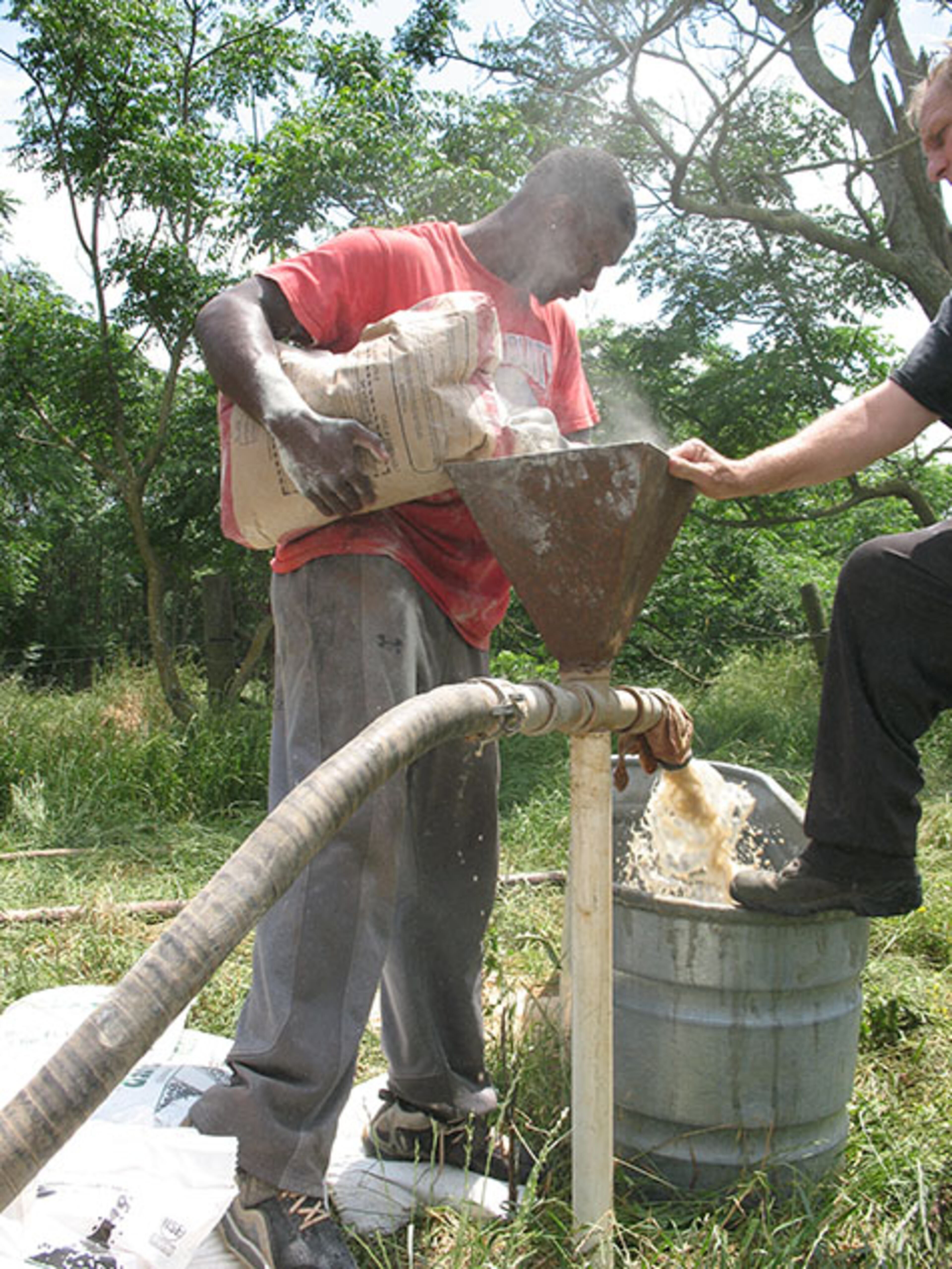 Drilling wells is hard work and dirty work. One of Smith's primary jobs was hauling 50-pound bags of bentonite from the back of the truck to well site and then pouring them slowly into the mix.