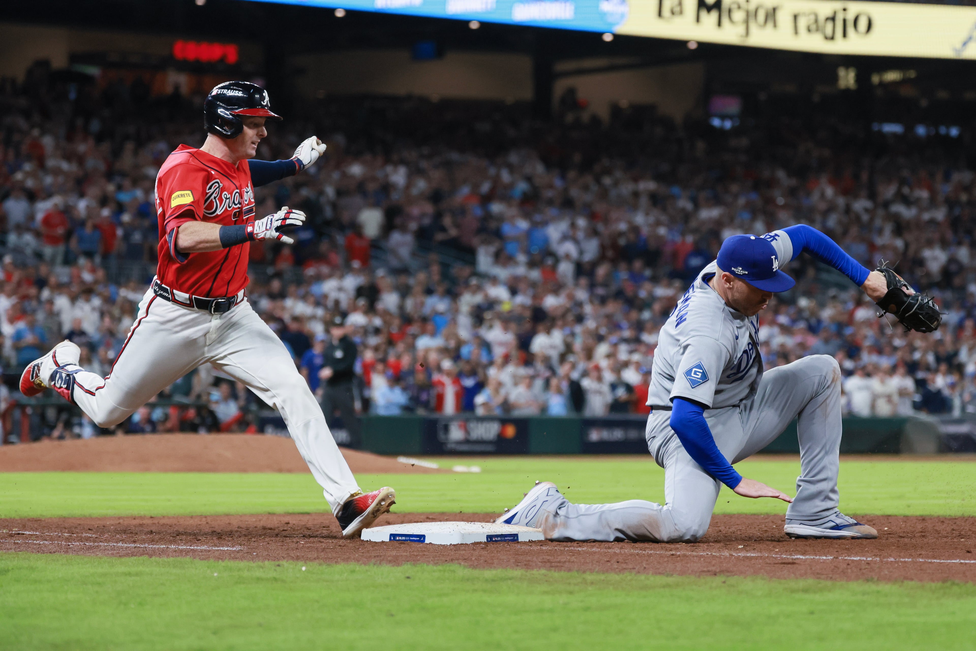 Atlanta Braves pinch hitter Mike Yastrzemski (18) grounds out against Los Angeles Dodgers first baseman Freddie Freeman (5) for the final out during the ninth inning of Game 3 of the MLB National League Division Series between the Atlanta Braves and the Los Angeles Dodgers, Tuesday, Oct. 6, 2026, in Atlanta. (Jason Getz/AJC)
