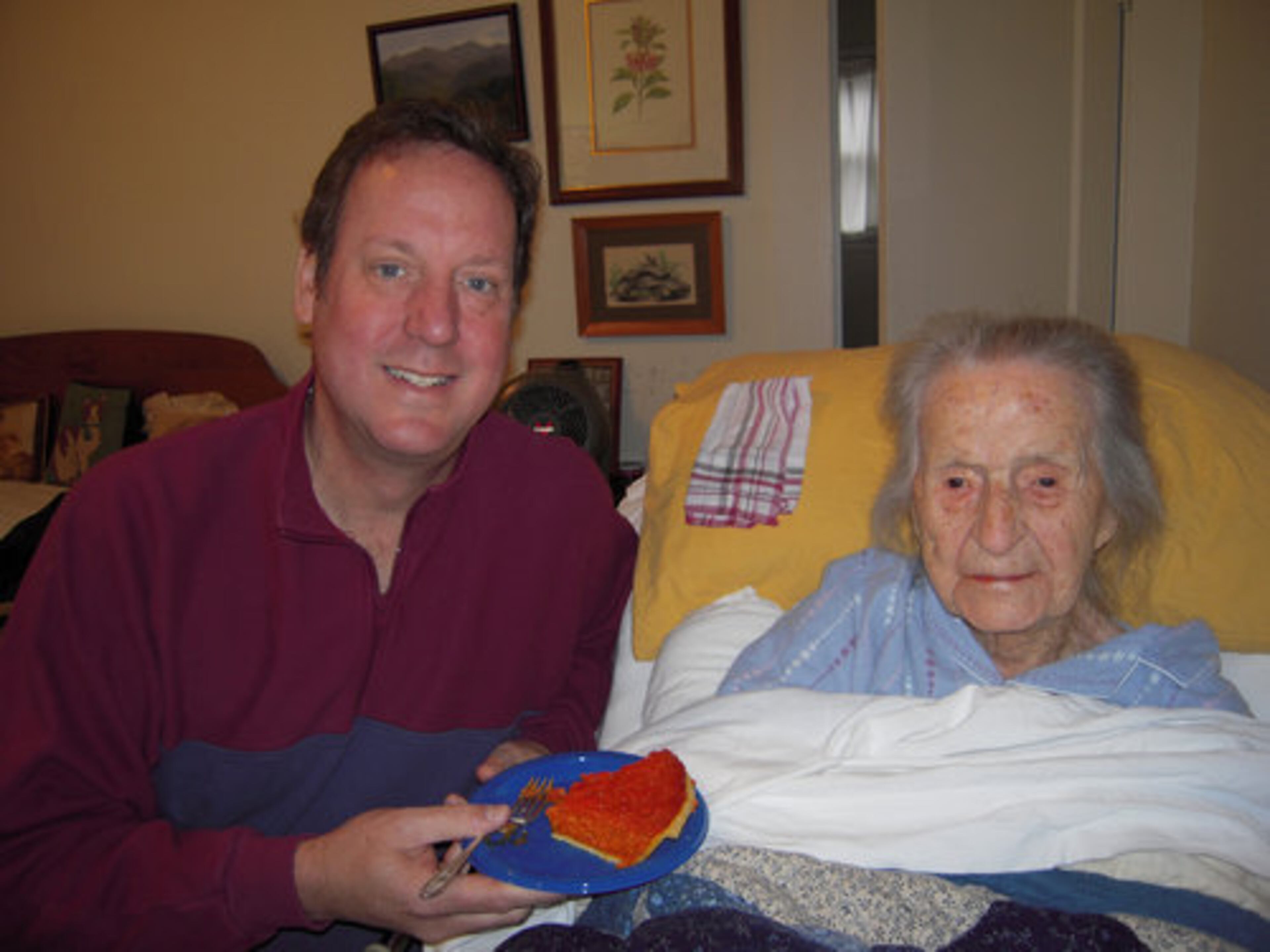 Leila Denmark and grandson Steve Hutcherson celebrate her 113th birthday with pie in 2011.