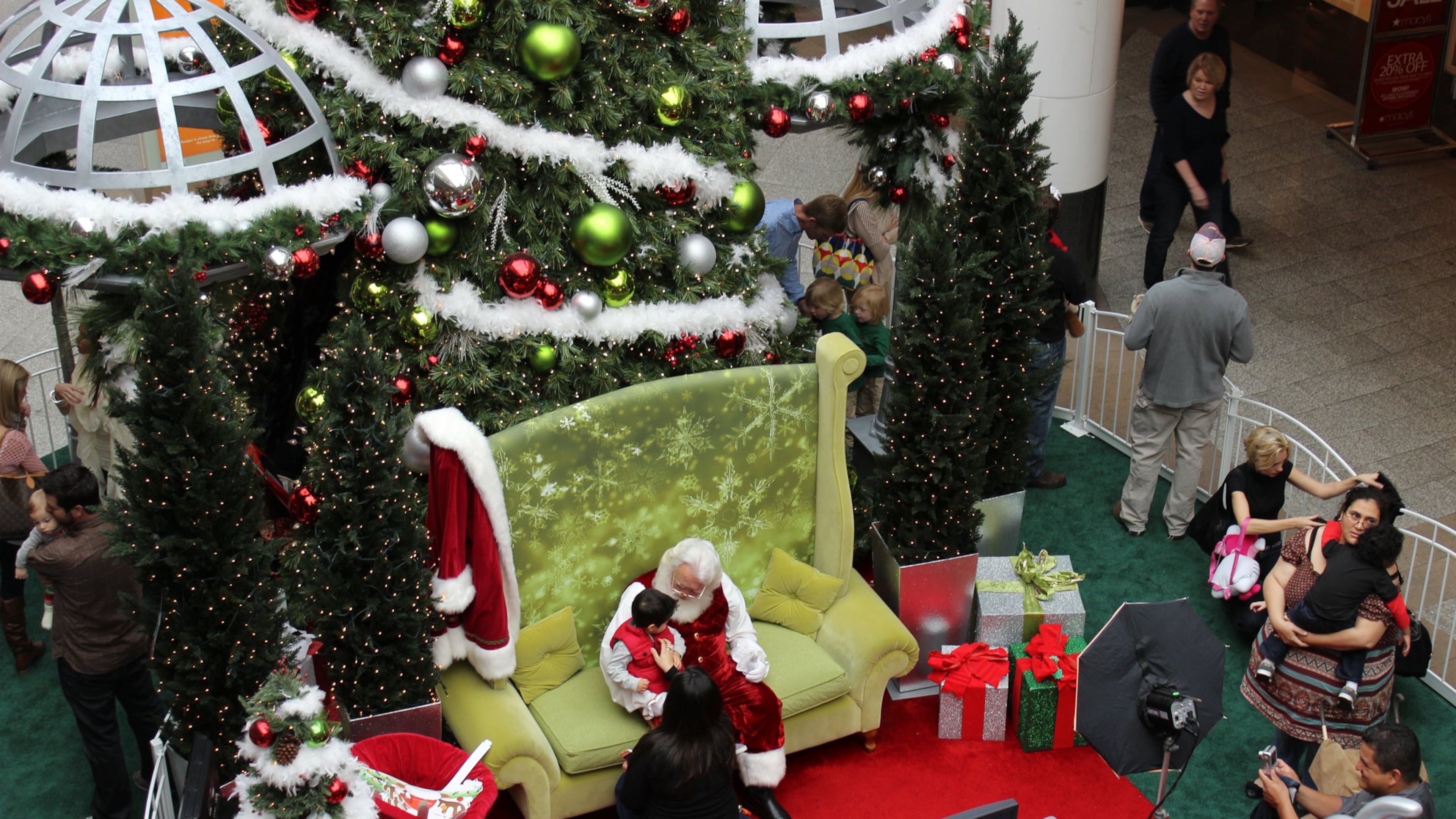 Shoppers at Lenox Square during a visit and photo session with Santa. Lenox and many other local malls also offer sessions with Santa designed specifically for kids with autism and other special needs. (SIMON MALLS)
