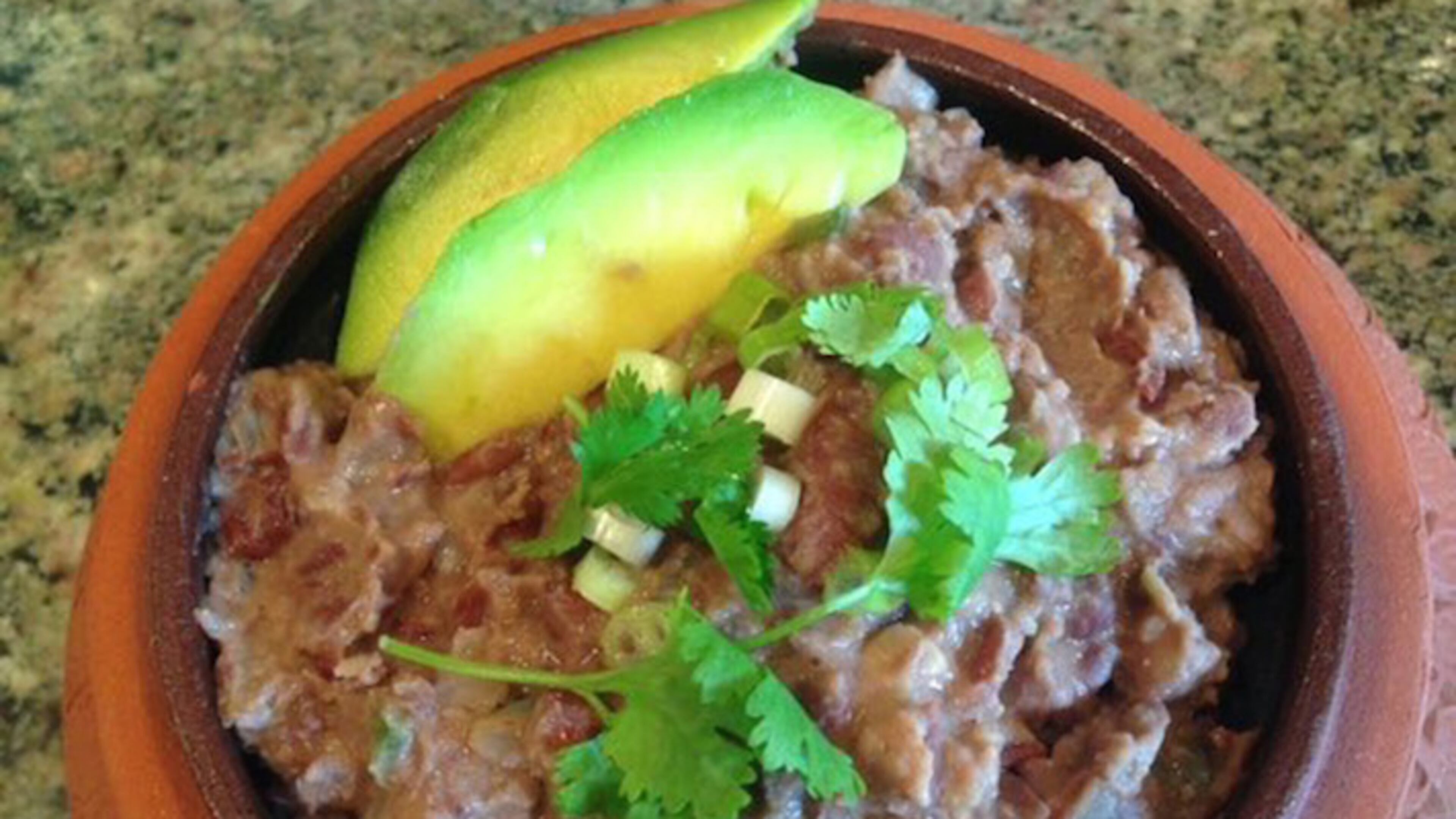 On nachos or on their own, homemade refried beans taste better and are healthier than the canned versions. (Ellen Kanner/Miami Herald/TNS)