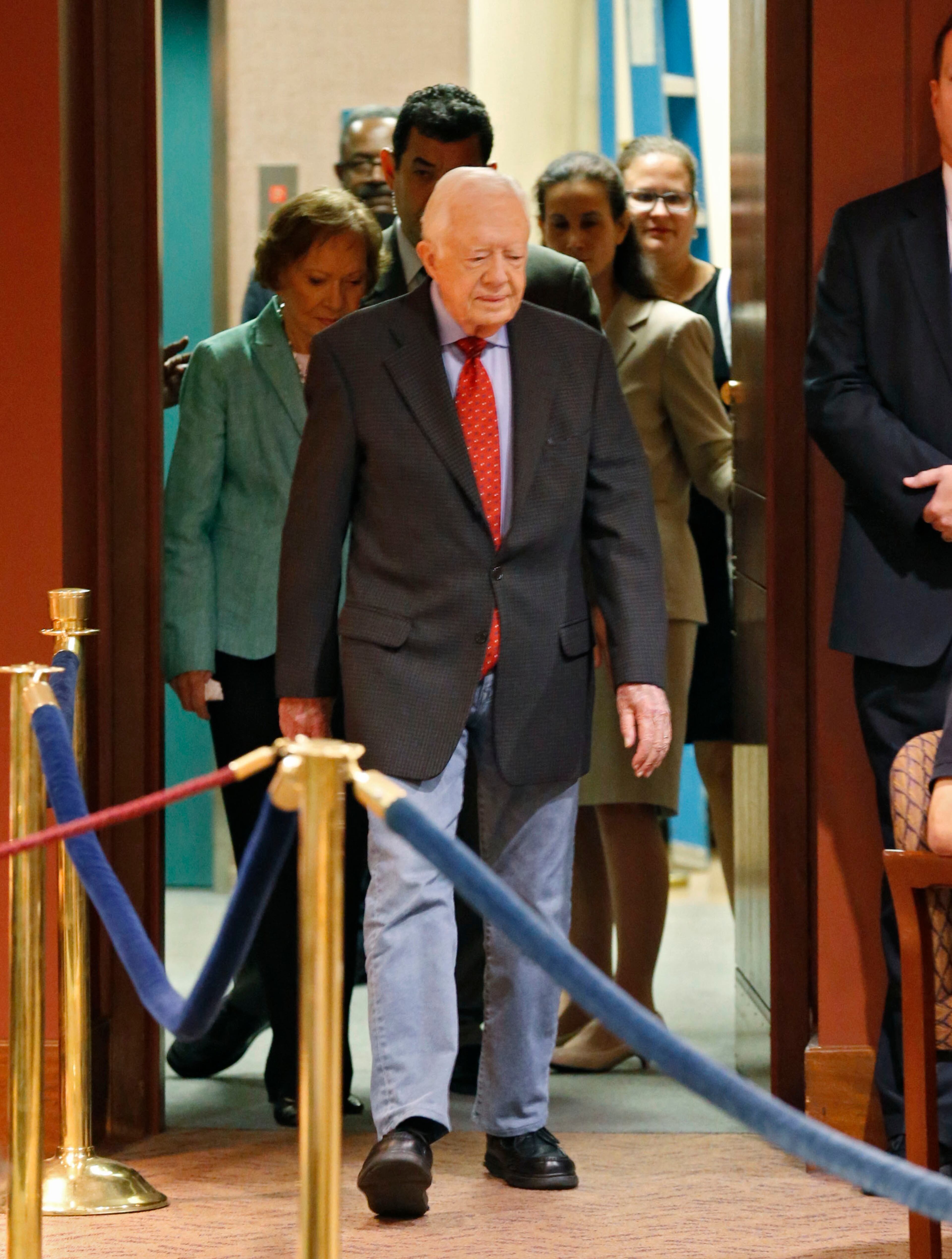August 20, 2015 - Atlanta -Jimmy and Rosalynn Carter make their way into the press conference. Former President Jimmy Carter discusses his cancer diagnosis at the Carter Center Thursday. The 90-year-old announced he had cancer after doctors removed small masses from his liver earlier this month. BOB ANDRES / BANDRES@AJC.COM