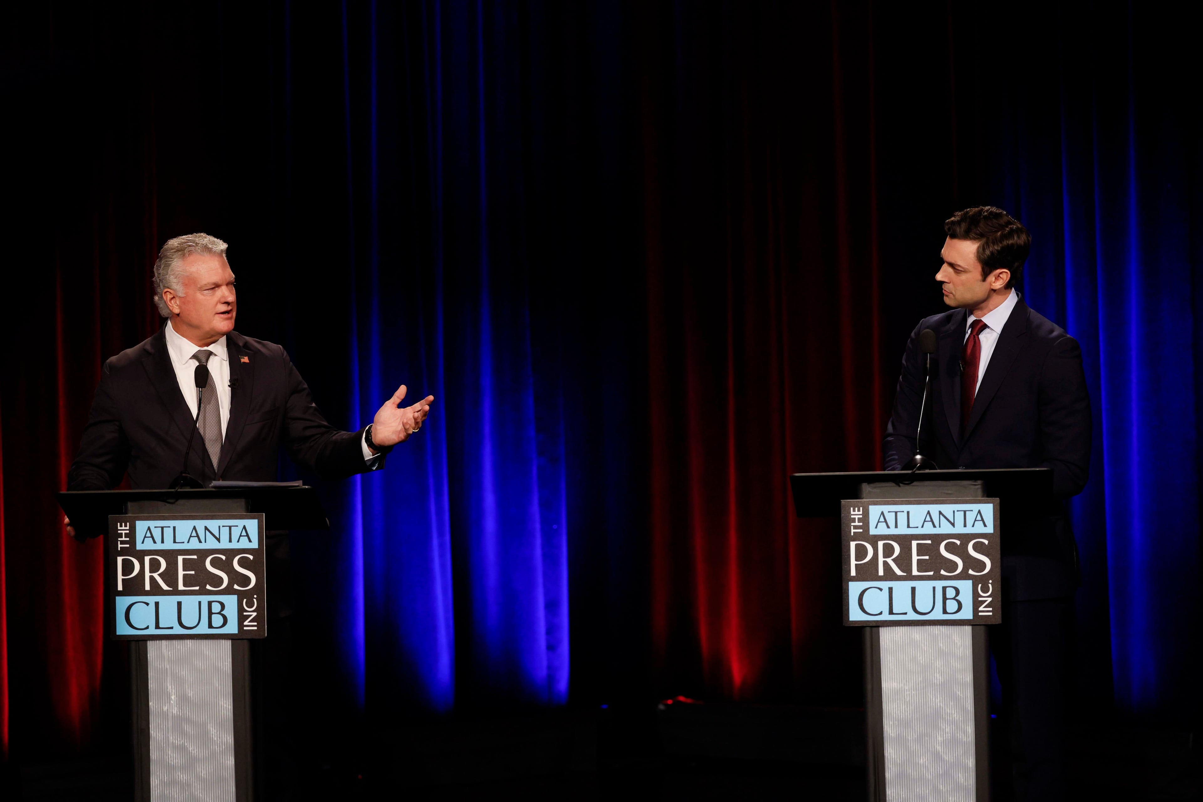 Republican U.S. Rep. Mike Collins debates incumbent Democratic U.S. Sen. Jon Ossoff during the Loudermilk-Young Senate Debate Series Tuesday night. (Miguel Martinez/AJC)