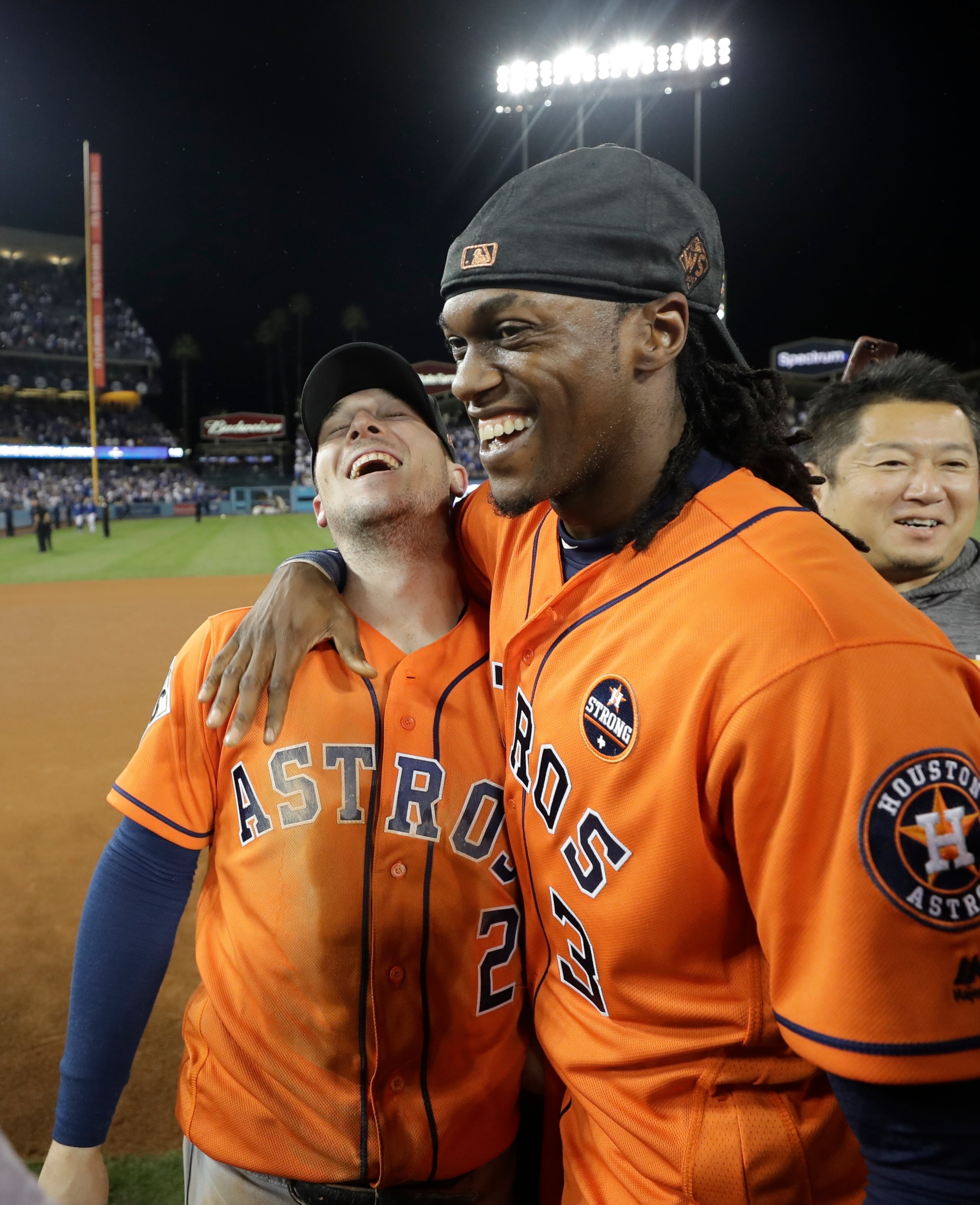 Houston Astros' Alex Bregman and Cameron Maybin celebrate after Game 7. Maybin is a former Braves player too. (AP Photo/David J. Phillip)