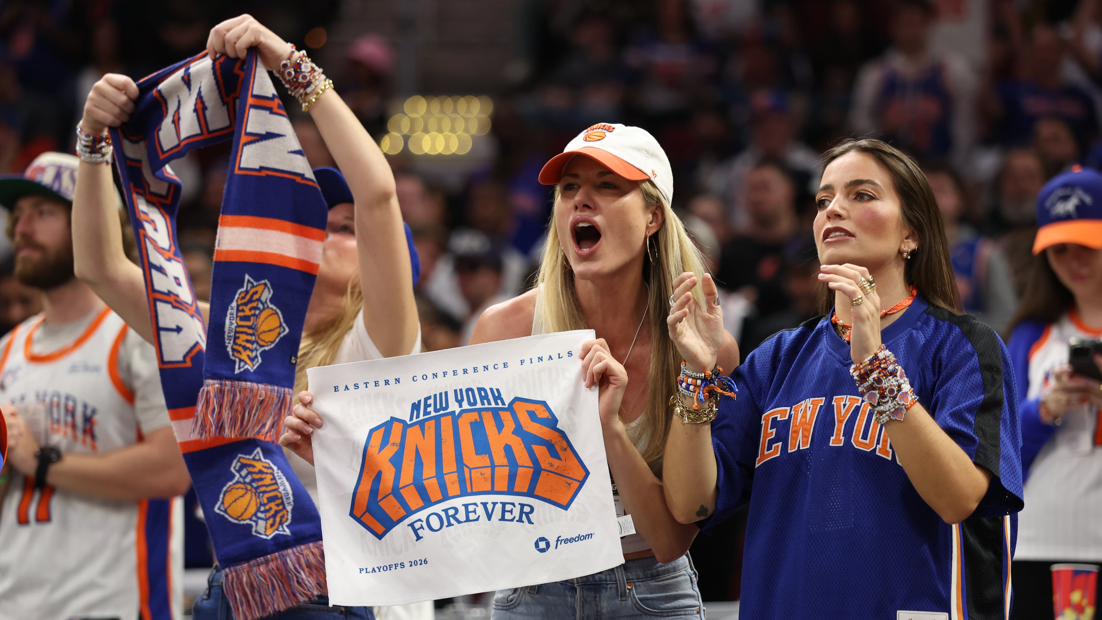 New York Knicks fans cheer during the second half of Game 4 in the Eastern Conference finals NBA basketball playoffs series against the Cleveland Cavaliers in Cleveland, Monday, May 25, 2026. (AP Photo/Tim Phillis)