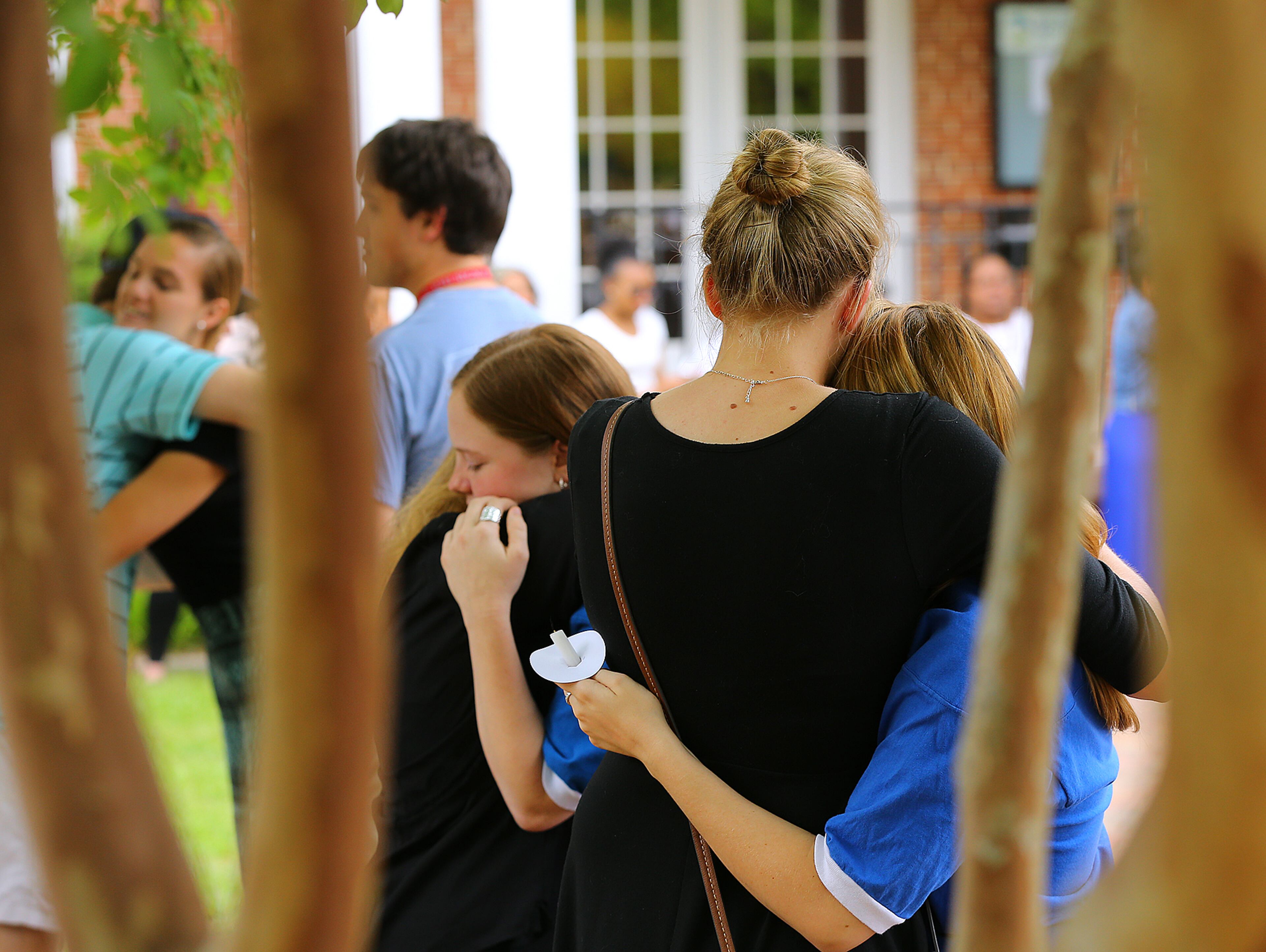Students console each other during the Memorial Service held April 23, 2015, at Georgia Southern University for five nursing students whose lives were tragically lost in an accident on April 22, 2015, in Statesboro. Curtis Compton / ccompton@ajc.com