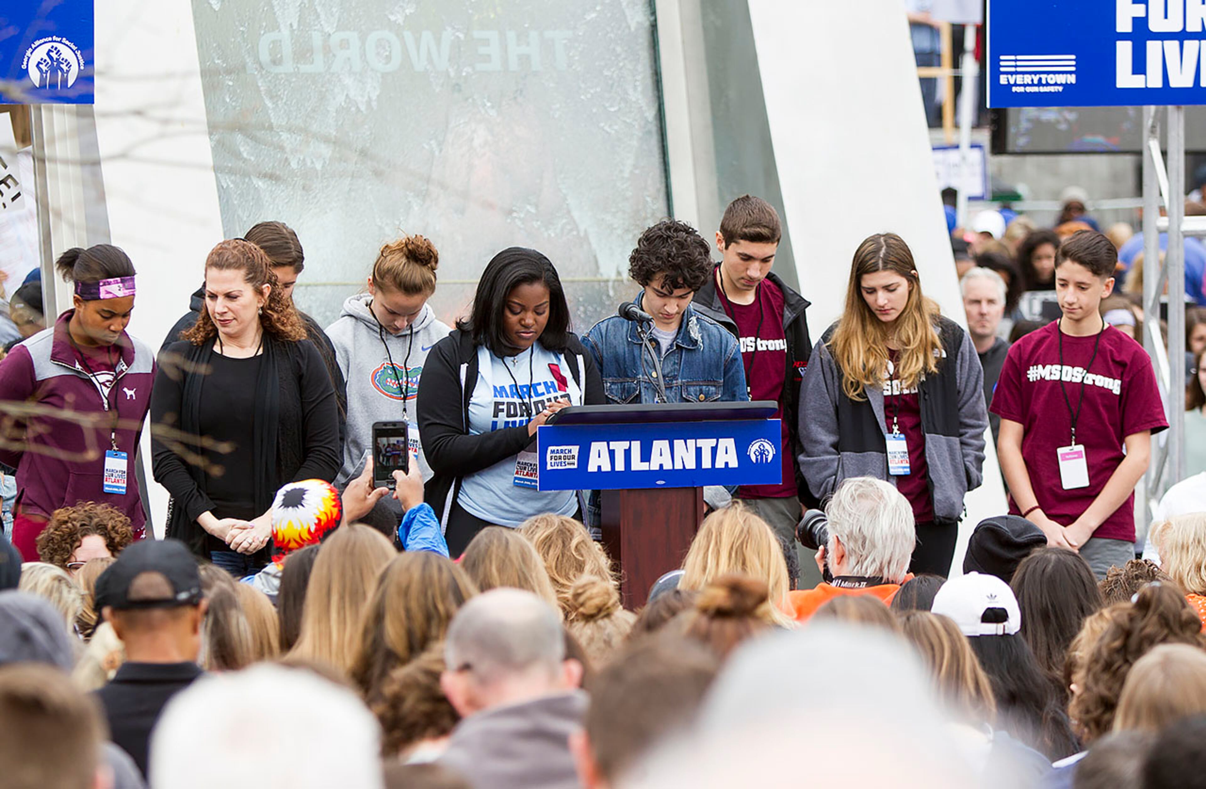 Survivors of the Marjory Stoneman Douglas shooting help lead a moment of silence during the March for our Lives event in Atlanta, Georgia, on Saturday, March 24, 2018. (REANN HUBER/REANN.HUBER@AJC.COM)