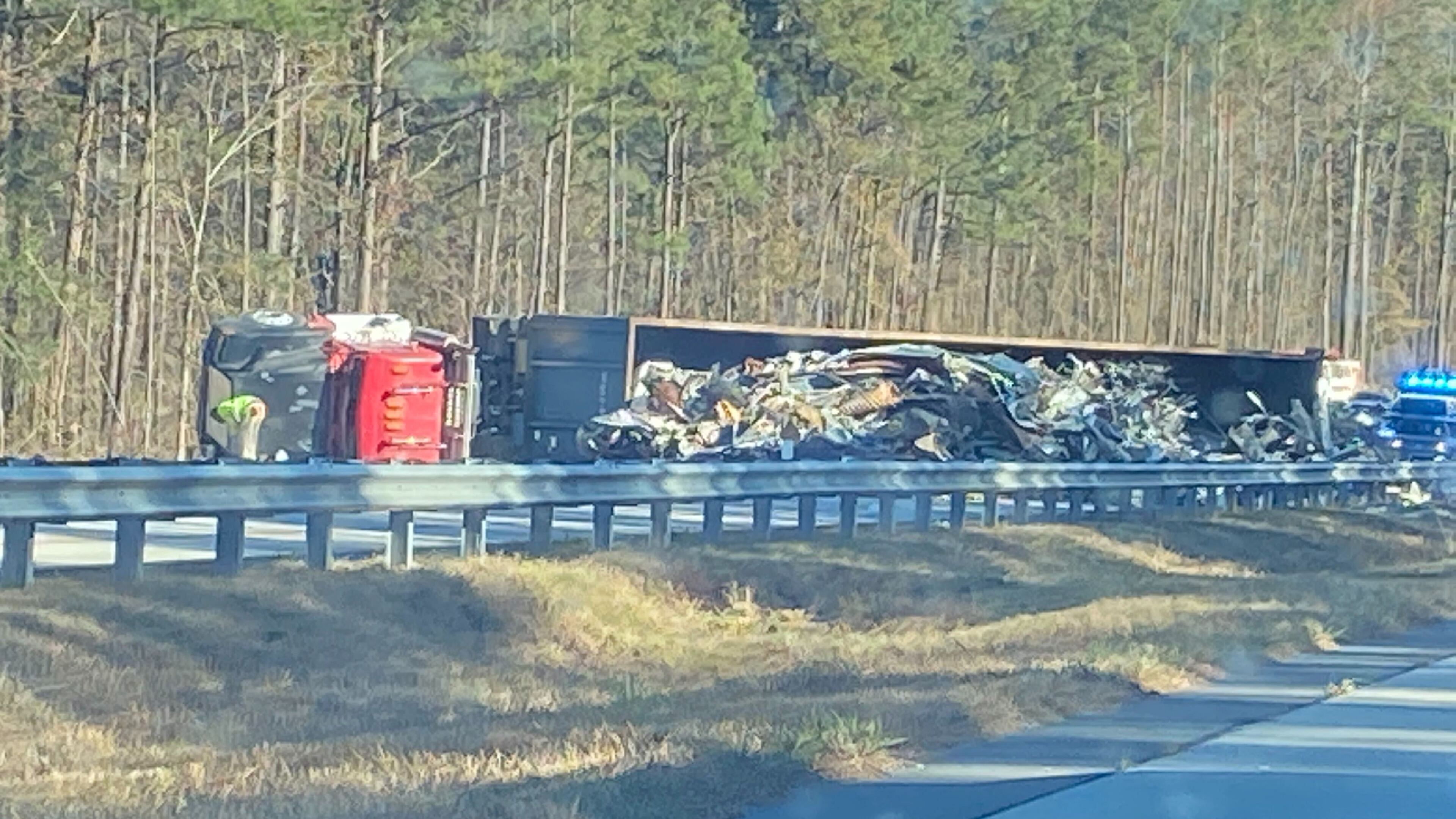 An overturned tractor-trailer is blocking the southbound lanes of Ga. 400 in Forsyth County.