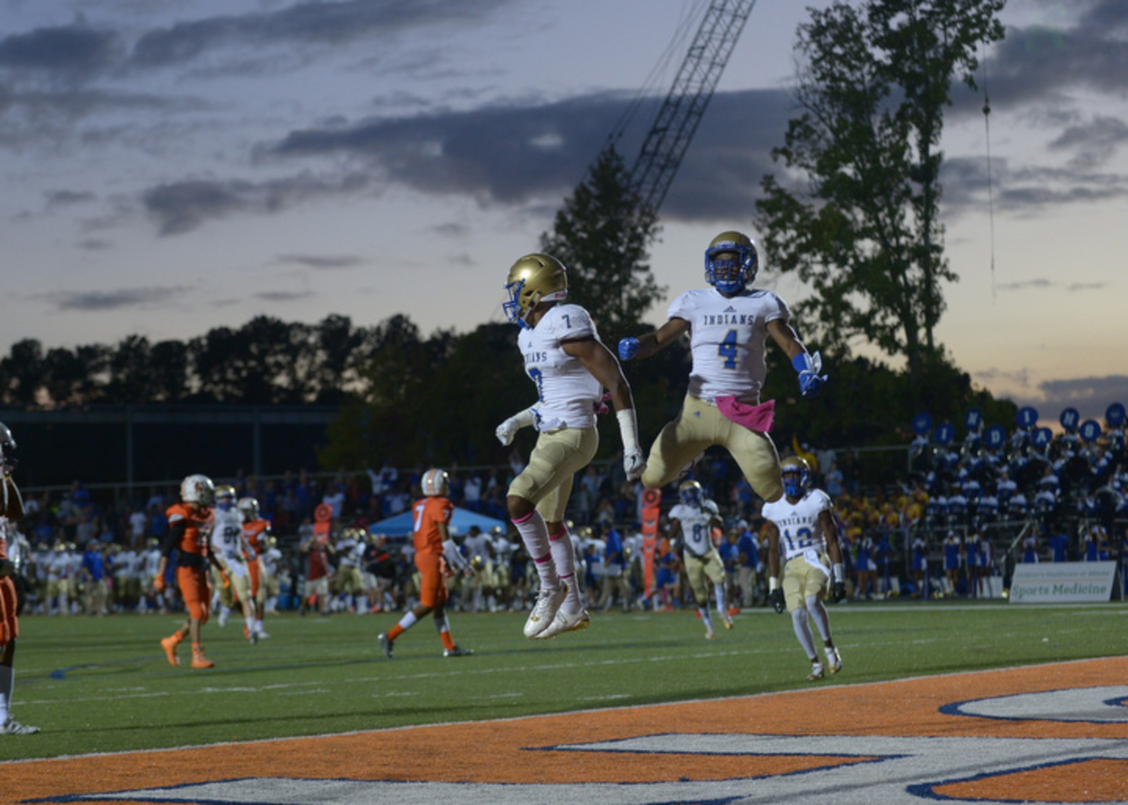 Kennesaw, Ga. -- McEachern senior wide receivers Jaron Hull (4) and Genuine Potts (7) celebrate after Potts scored the Indians' first touchdown early in the first half of their game at North Cobb Friday, October 6, 2017. Special/Daniel Varnado
