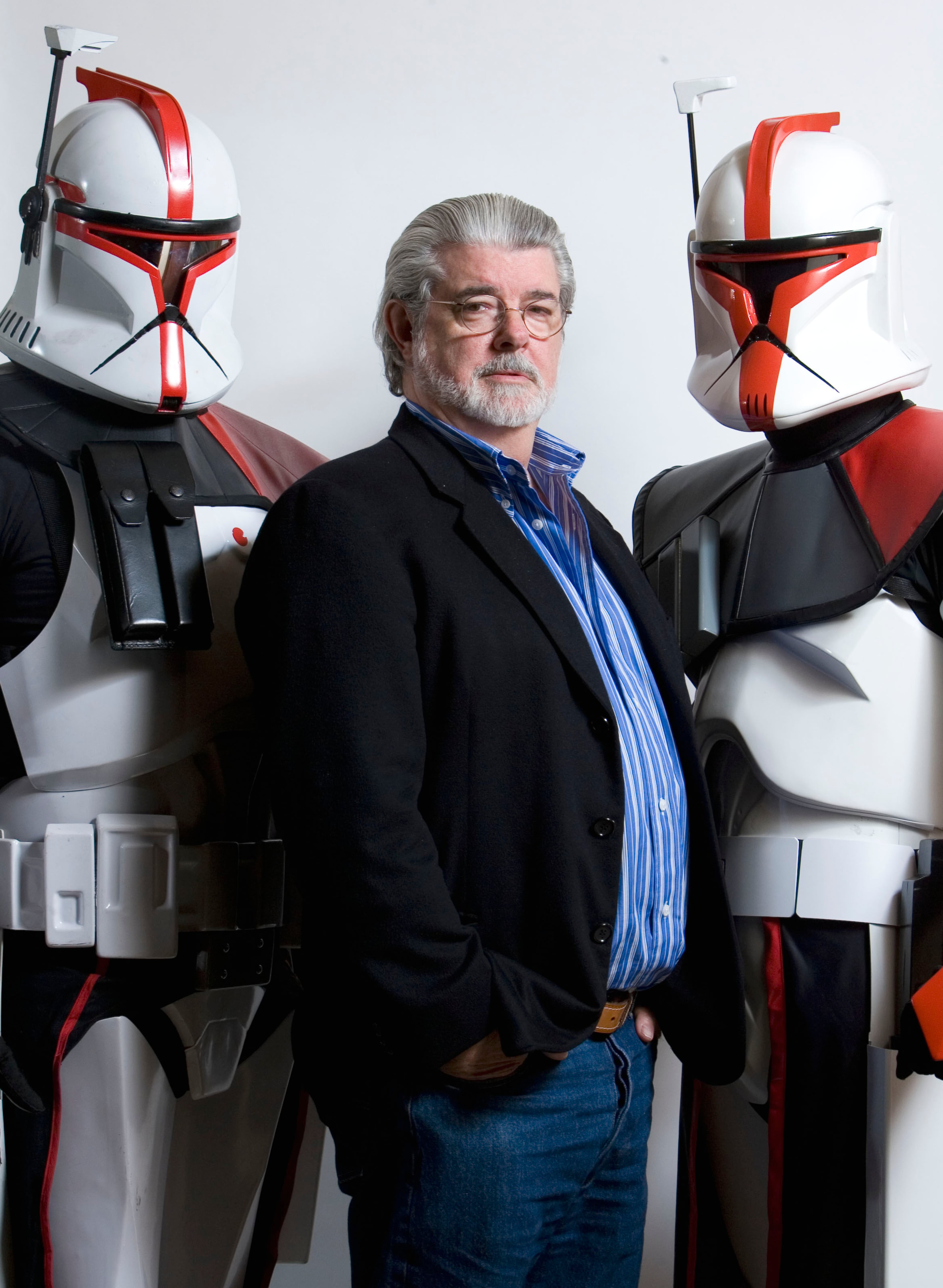 Director-producer George Lucas, center, poses for portrait with a pair storm troopers from his "Star Wars" films in Las Vegas on March 13, 2008.