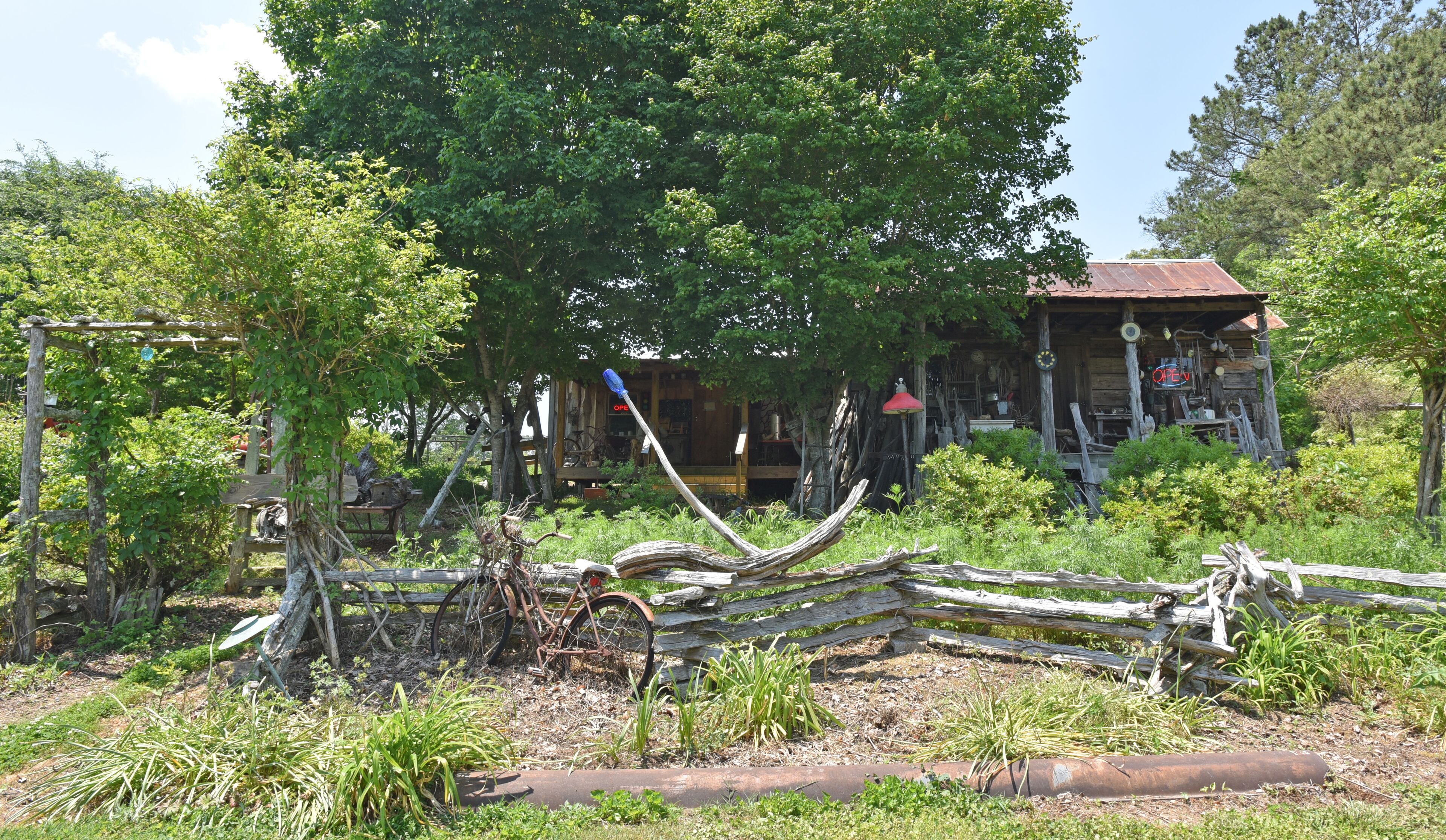 May 9, 2015 Summerville - Exterior of Maxey Folk Art - folk art, antique pottery, day lily shop - in Gore, near Summerville, on Saturday, May 9, 2015. Famous folk artist Howard Finster began creating Paradise Gardens in 1961. It is listed as one of Georgia's noted art attractions. Finster's outsider art -- sculpture and paintings -- draws tourists from around the world. In advance of Finster Fest, May 30-31 in the northwest Georgia town of Summerville. Georgia's most famed folk artist, Finster was known as a great American eccentric, and plenty of eccentric places survive him in this gritty corner of the state. HYOSUB SHIN / HSHIN@AJC.COM