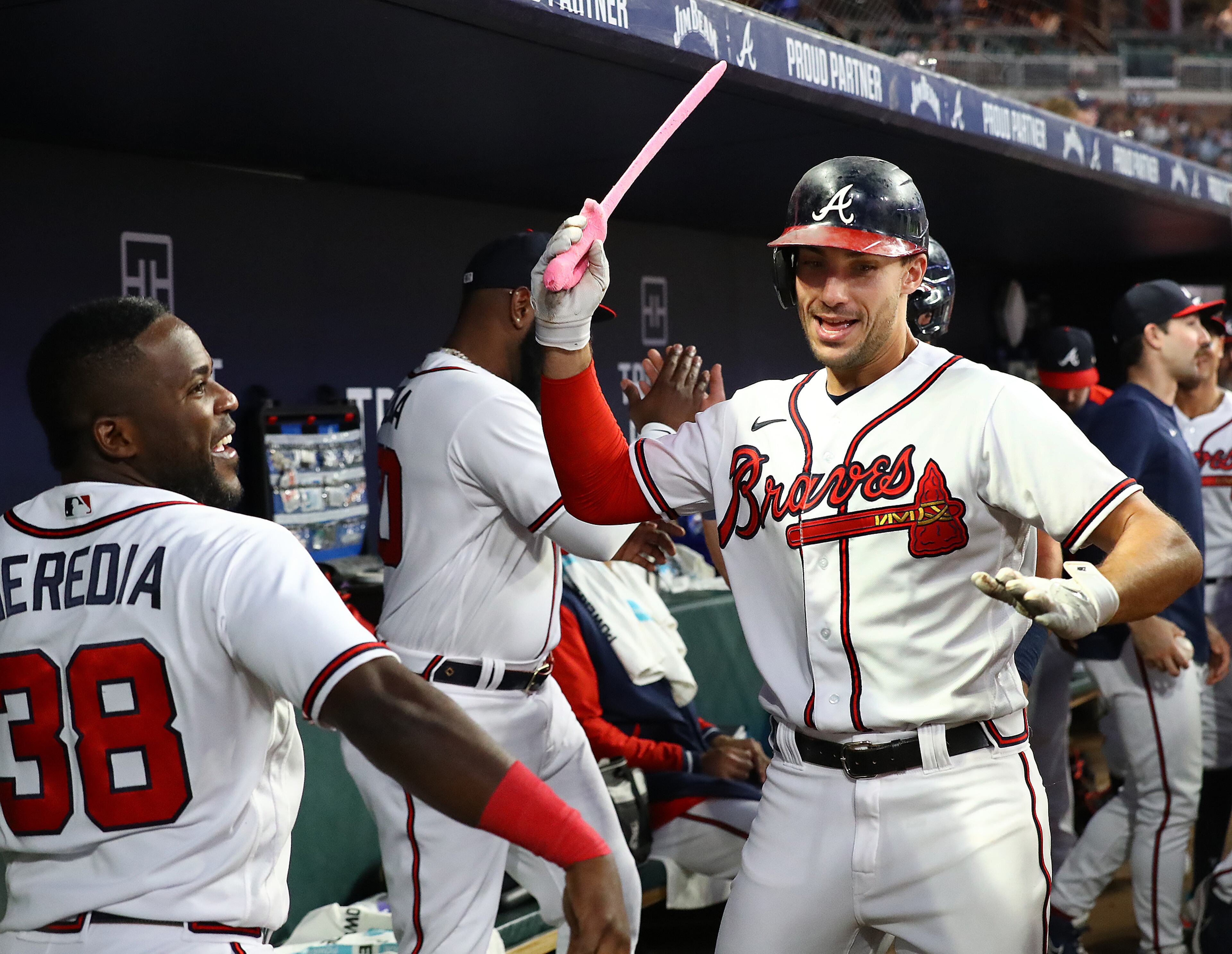 Braves first baseman Matt Olson swings the pink sword celebrating in the dugout after hitting a 2-RBI home run to take a 3-0 lead over the New York Mets during the fourth inning in a MLB baseball game on Tuesday, August 16, 2022, in Atlanta. The Braves won 5-0. “Curtis Compton / Curtis Compton@ajc.com