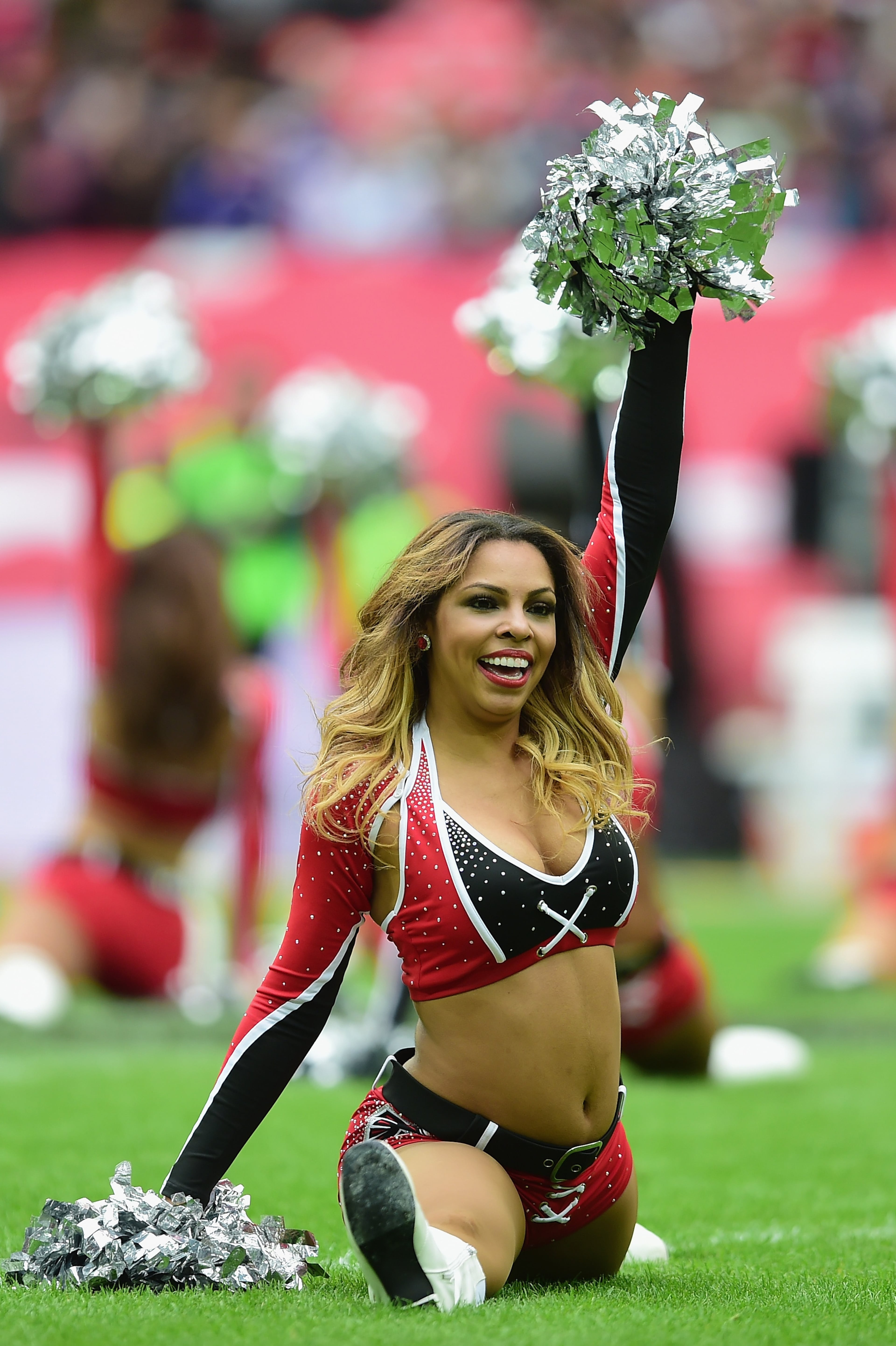 Falcons cheerleaders perform during the NFL match between Detroit Lions and Atlanta Falcons at Wembley Stadium on October 26, 2014 in London, England. (Photo by Jamie McDonald/Getty Images)