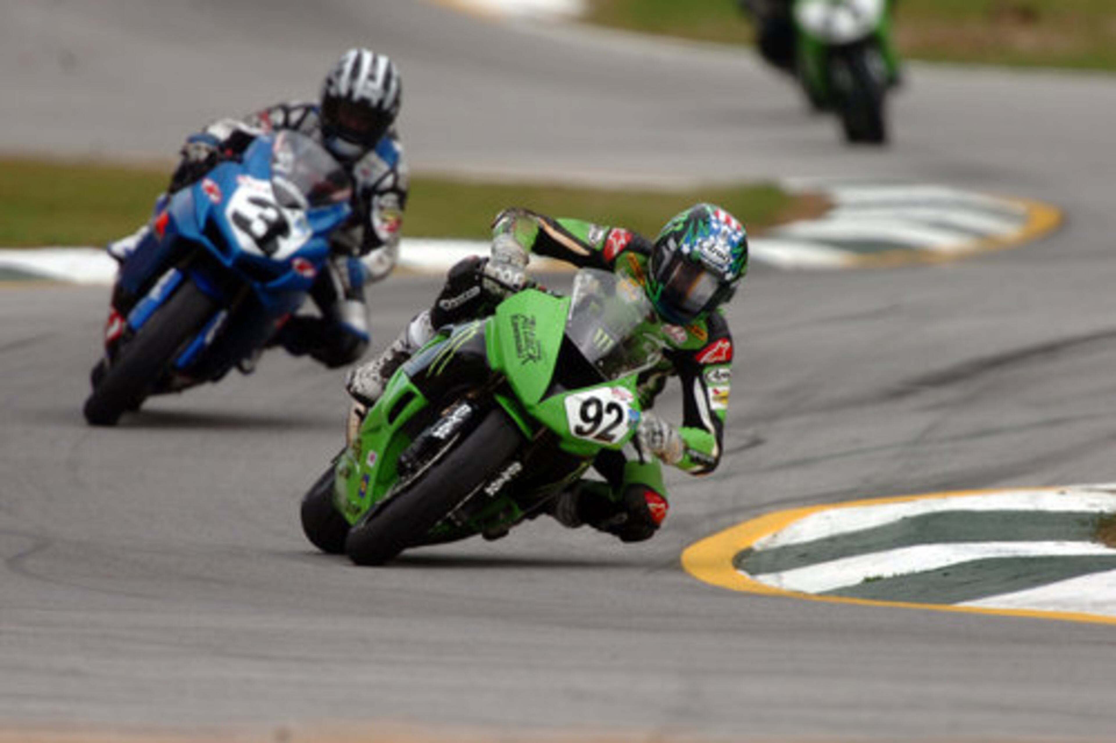 Leandro Mercado (92) maintains his position ahead of Kris Turner.