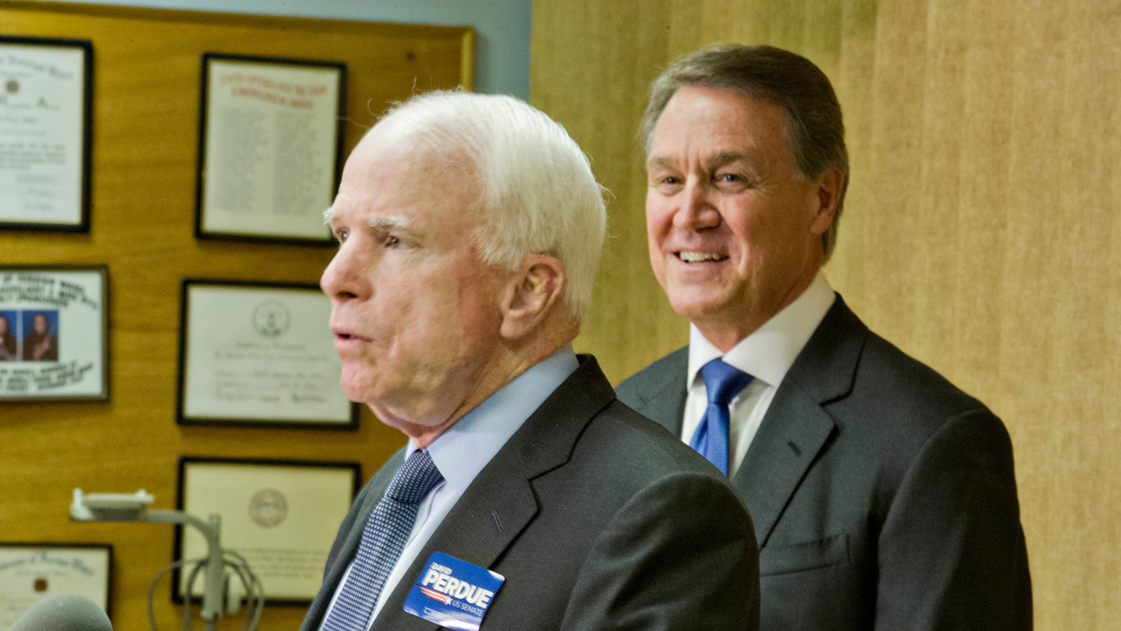 October 15, 2014 Marietta - Senator John McCain (left) and Republican candidate David Perdue answer questions by members of the media after speaking at the VFW Post 2681 in Marietta on Wednesday, Octber 15, 2014. JONATHAN PHILLIPS / SPECIAL
