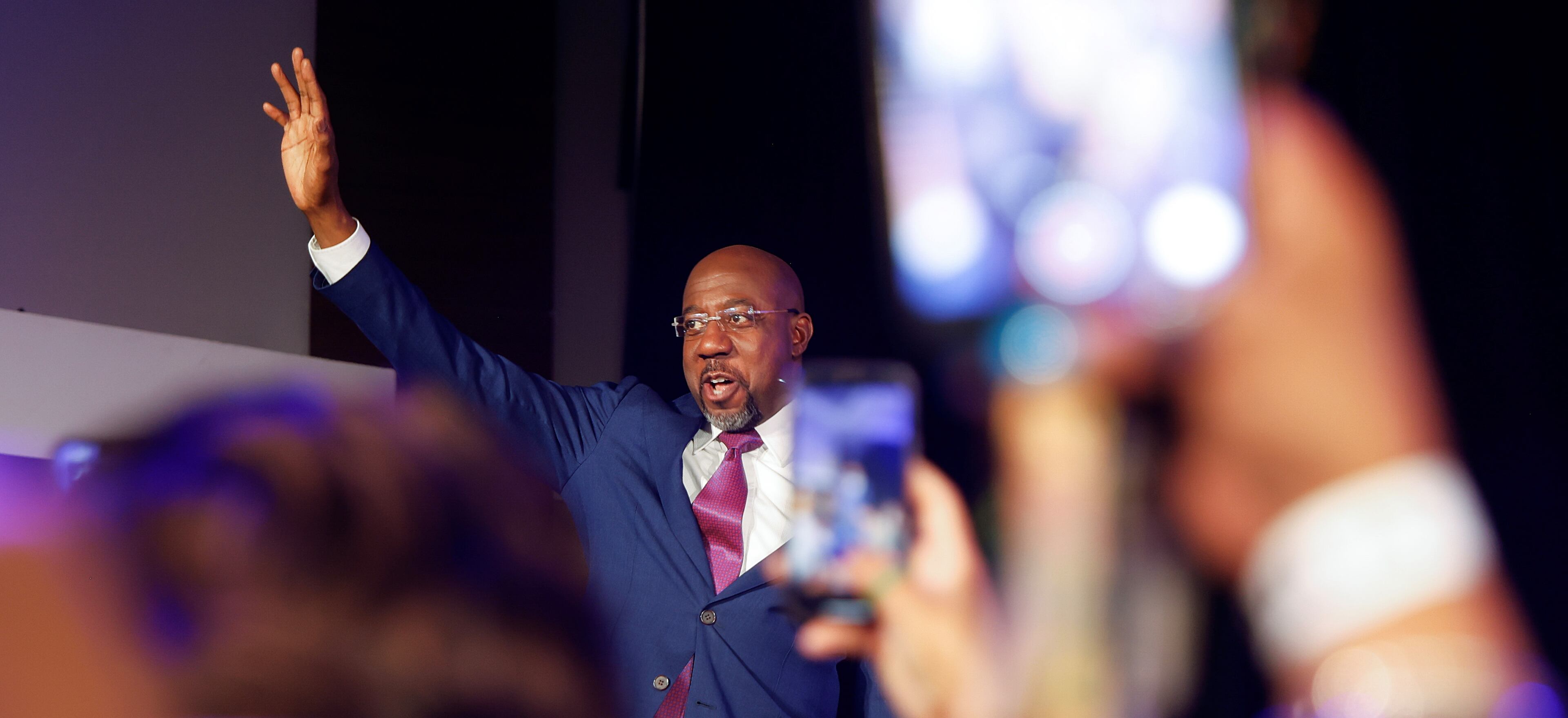 Sen. Raphael Warnock waves at supporters after winning the senate runoff election on Tuesday, December 6, 2022. (Natrice Miller/natrice.miller@ajc.com)