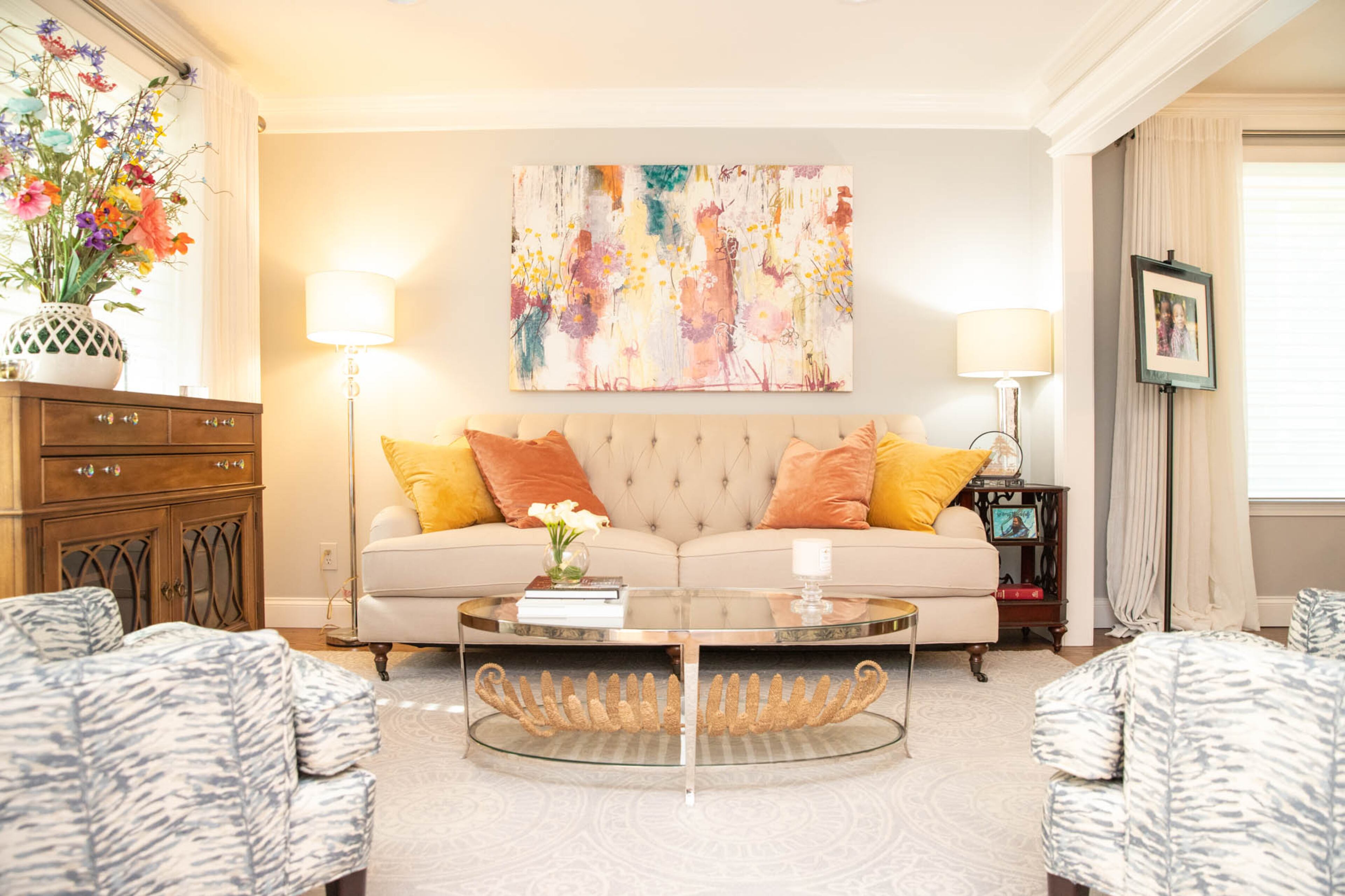 Liza and Kenneth Hare’s Stone Mountain home is chic and bright, with transitional style and an open, flowing floor plan. Liza Hare picked from a basic floor plan when she purchased her home in 2000, but in 2018 the couple renovated the bottom floor, remodeling the kitchen and opening up the space. The living room is comfortably appointed with a sofa from The Dump furniture outlet and a pair of chairs from Arhaus. Text by Shannon Dominy/Photo by Reynolds Rogers