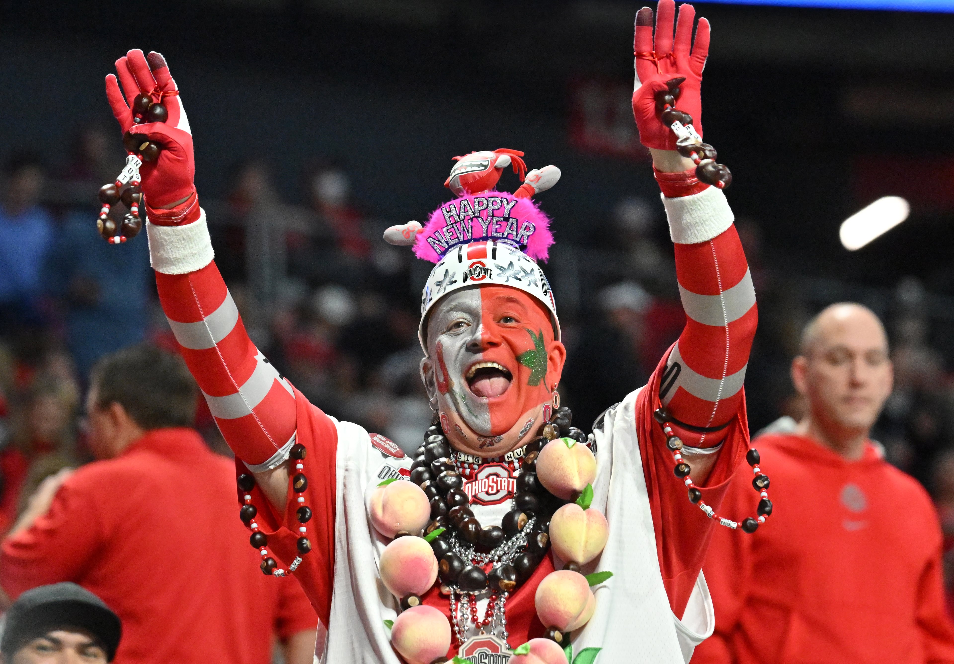 An Ohio State fan cheers before the 2022 CFP Semifinal against Georgia at the Chick-fil-A Peach Bowl Saturday, Dec. 31, 2022, in Atlanta. (Hyosub Shin / Hyosub.Shin@ajc.com)