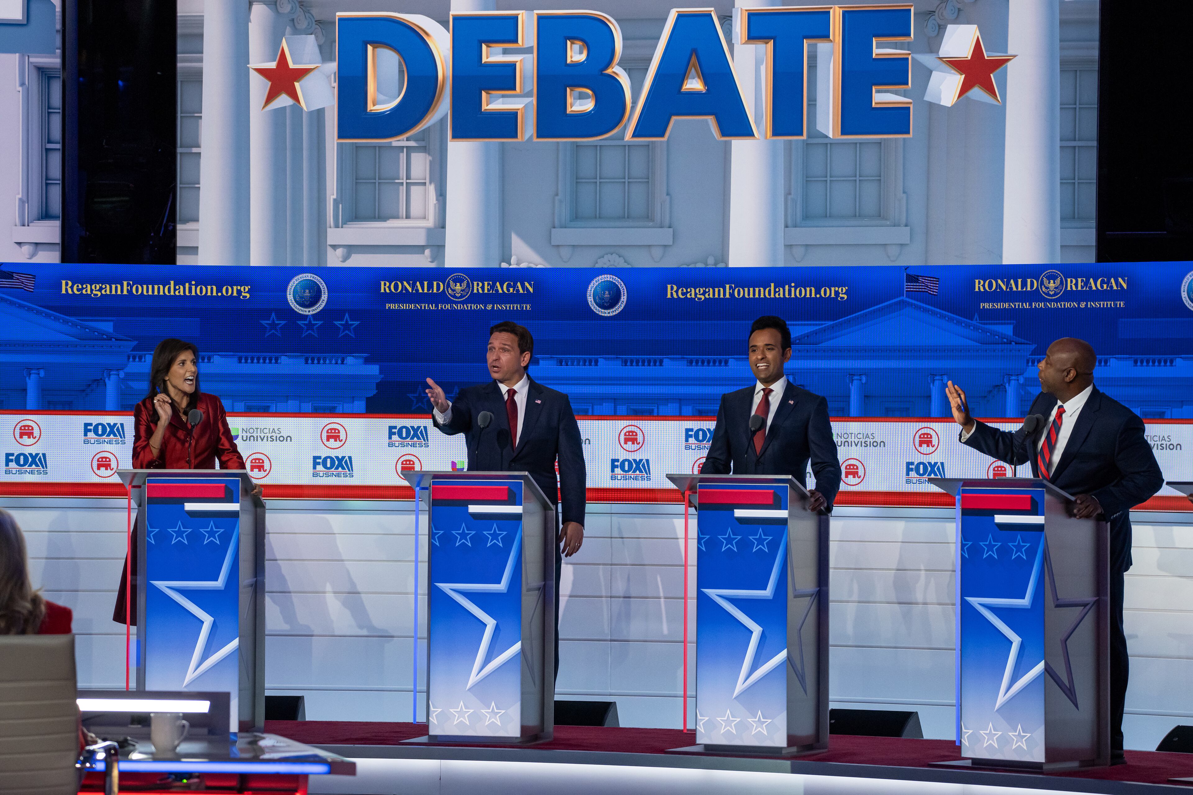 Wednesday night's Republican presidential debate featured plenty of combative shouting matches, such as this exchange involving, from left, former U.N. Ambassador Nikki Haley, Florida Gov. Ron DeSantis, tech entrepreneur Vivek Ramaswamy and South Carolina U.S. Sen. Tim Scott. The candidates, however, appeared to fail in their efforts to upend a race that has remained more or less stagnant for months. (Todd Heisler/The New York Times)