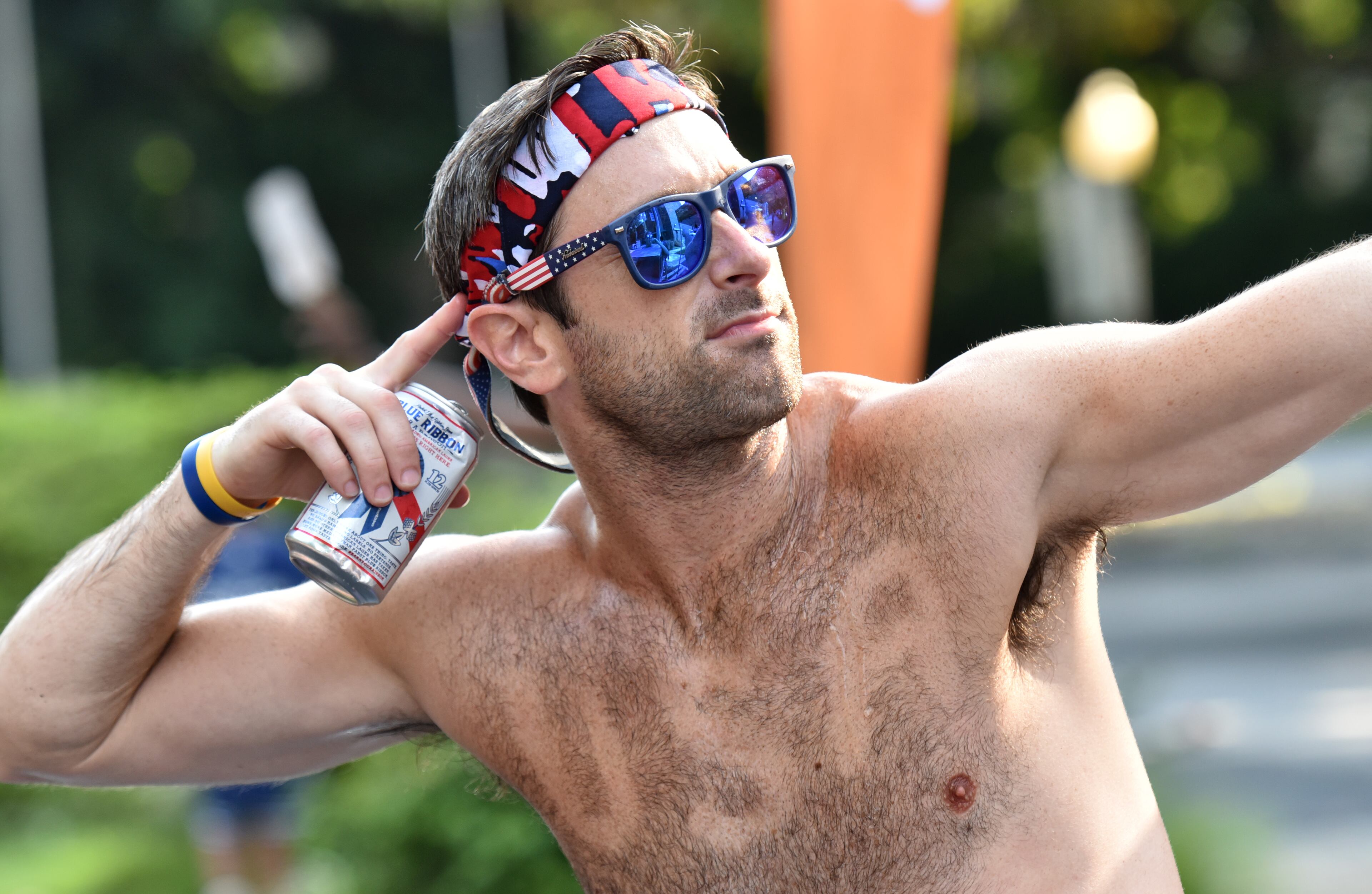 July 4, 2018 Atlanta - A patriotic runner poses at Cardiac Hill during the AJC Peachtree Road Race on Wednesday, July 4, 2018. HYOSUB SHIN / HSHIN@AJC.COM