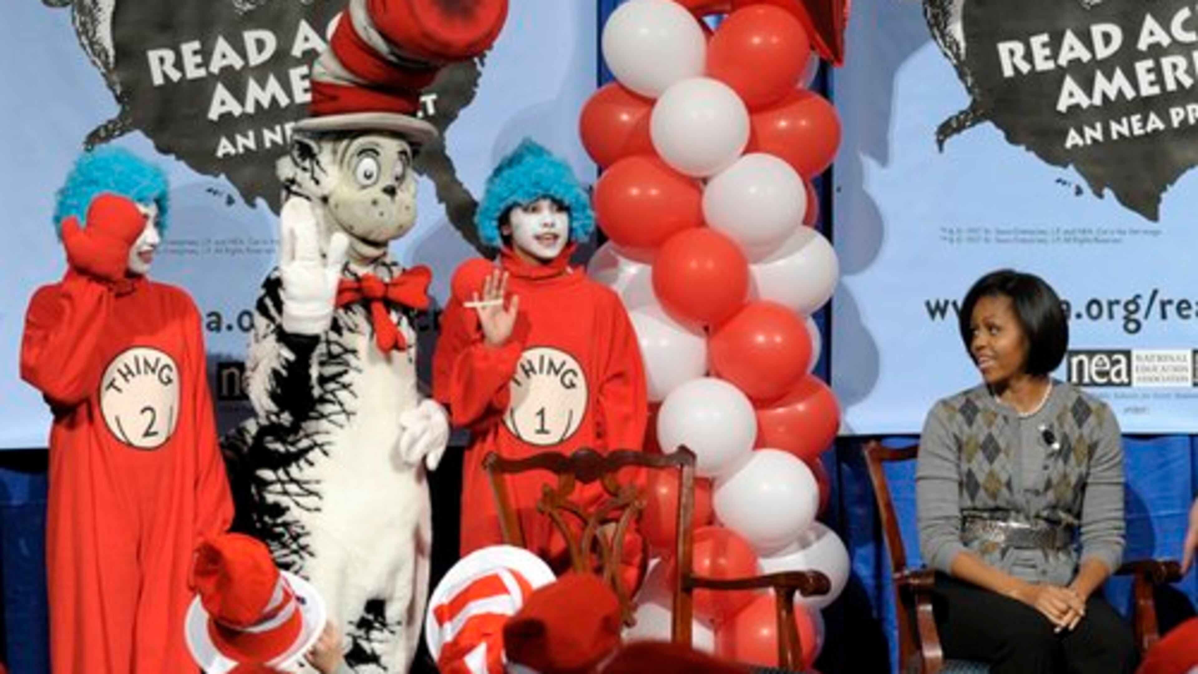 Former First lady Michelle Obama at "The Cat in the Hat" and "Thing 1 and Thing 2" during the National Education Association's 2010 Read Across America Day at the Library of Congress in Washington.
