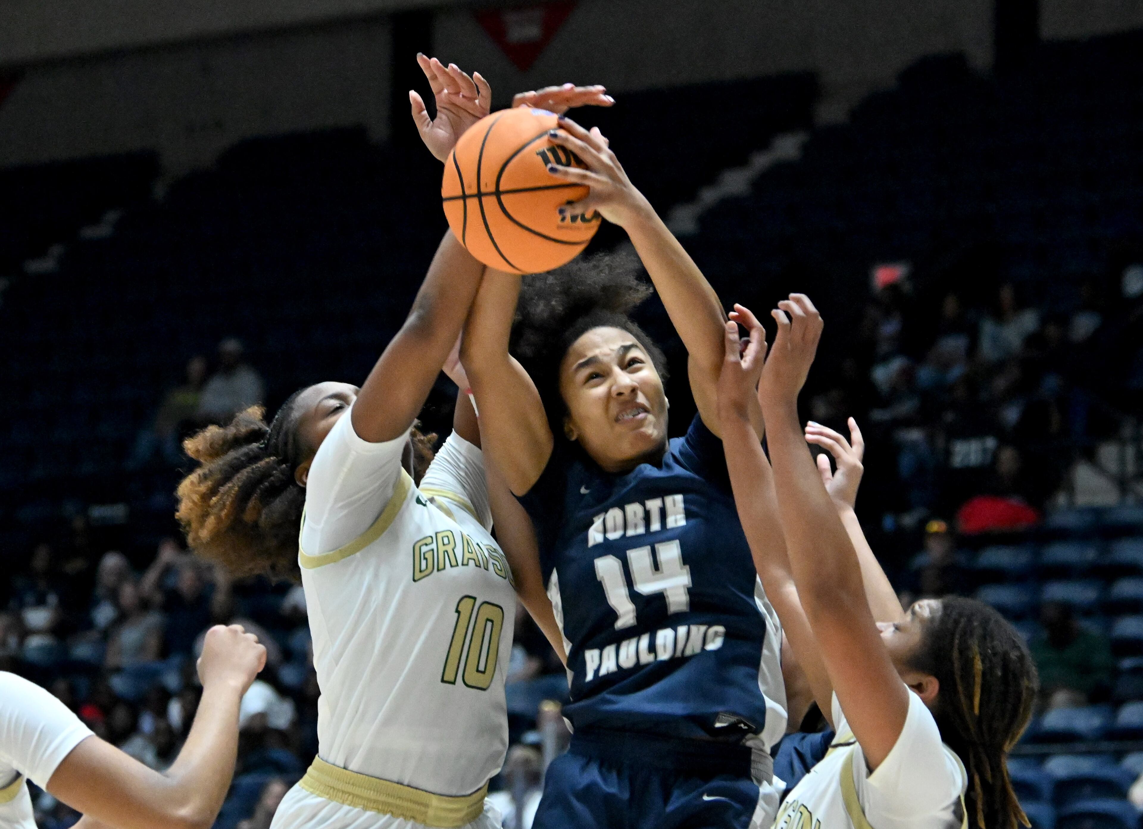 North Paulding Talya Arnold (14) grabs a rebound over Grayson Mya Glover (0) Grayson London Backman-Grier (10) during the first half in Class 6A Girls GHSA State Championship at the Macon Coliseum, Saturday, March 14, 2026, in Macon. (Hyosub Shin/AJC)