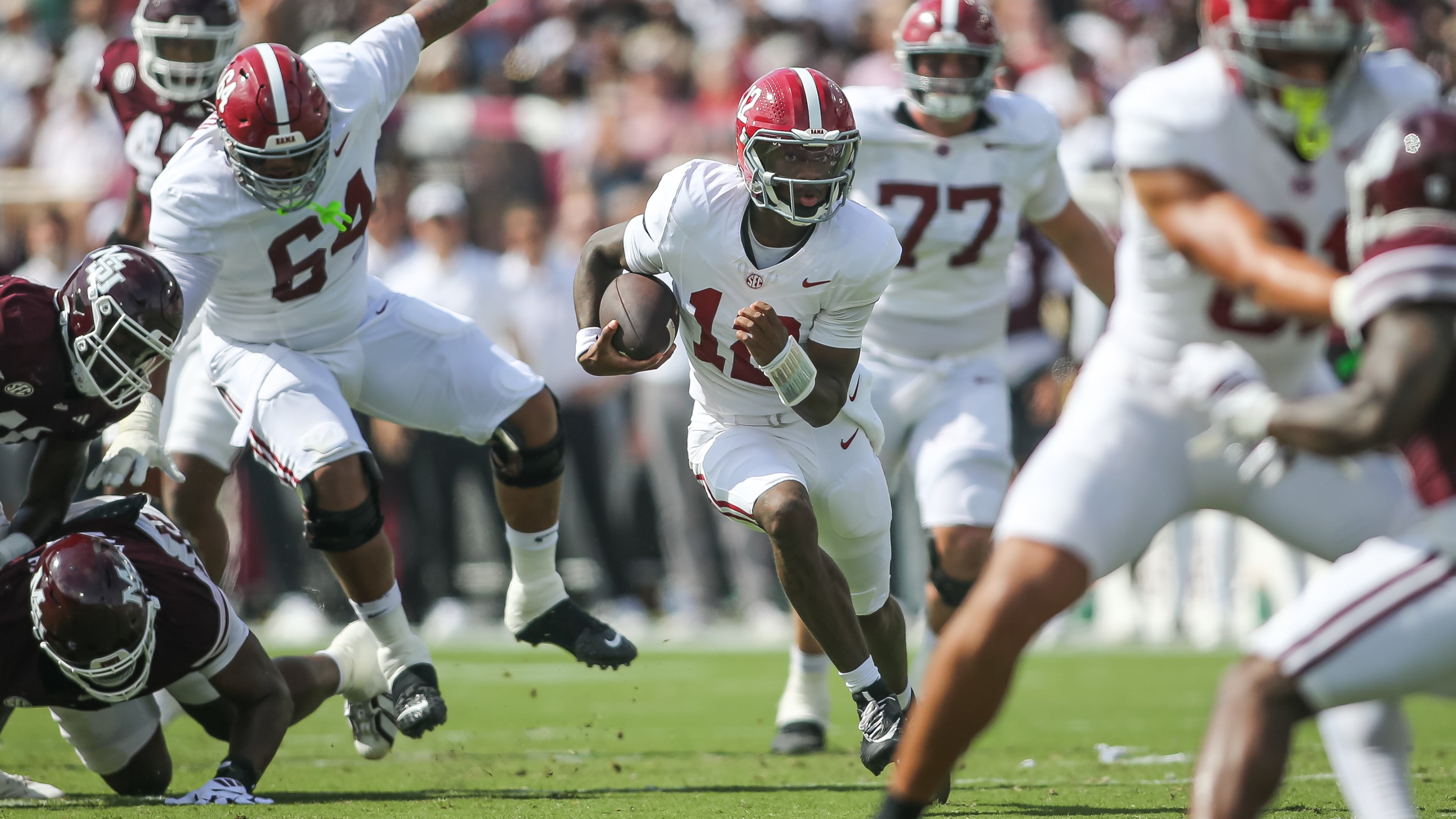 Alabama quarterback Keelon Russell (center) runs for a first down against Mississippi State during the first half of an NCAA college football game in Starkville, Miss., Saturday, Oct. 3, 2026. (James Pugh/AP)
