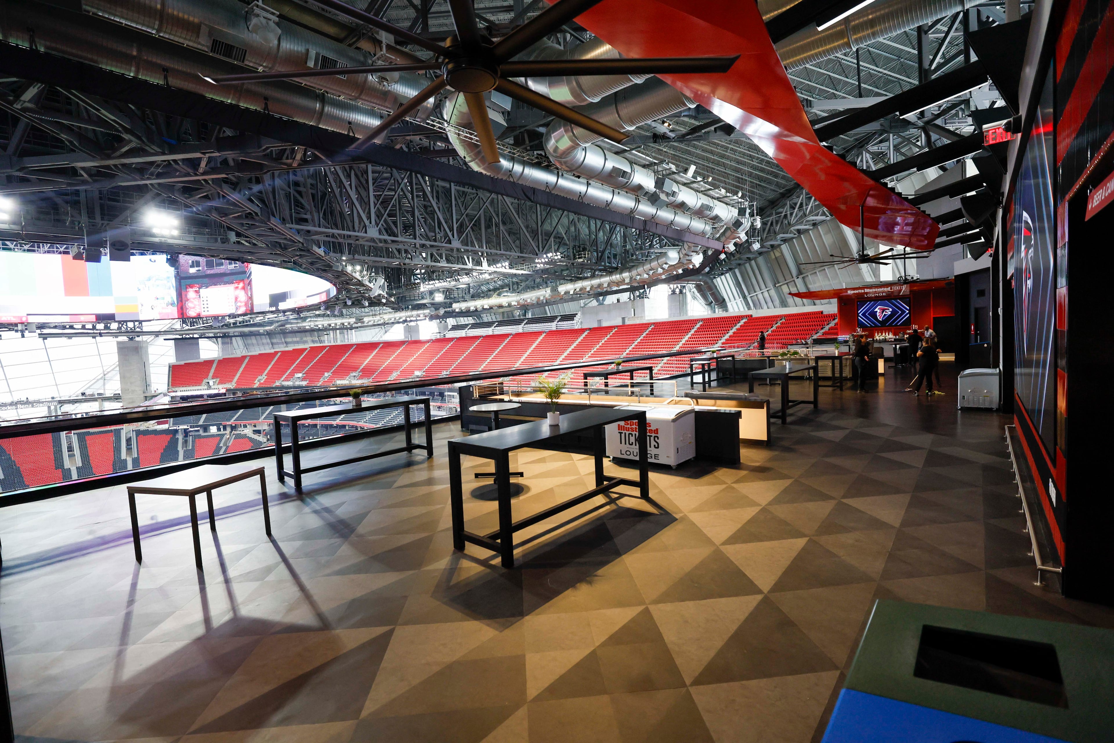Fans attending games and concerts at Mercedes-Benz Stadium will now have access to the new Sports Illustrated lounge. The 6,000-square-foot social space features 700 cushioned seats, food and beverage options, grab-and-go stations and multiple full-service bars. (Miguel Martinez/AJC)