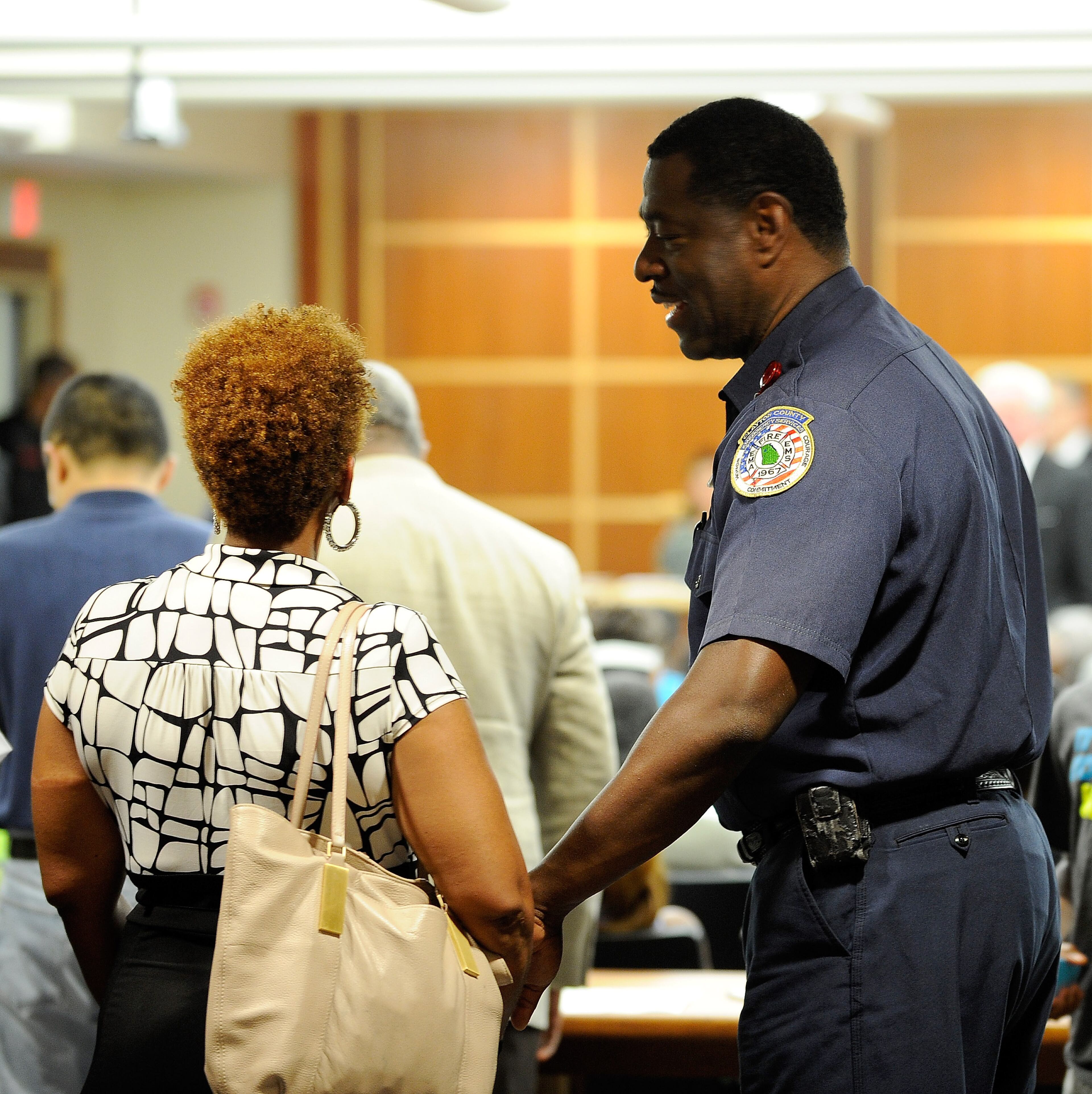 Clayton County fire department Lt. Slaughter controls a standing-room-only crowd as they line up to listen to presentations for and against a referendum to join MARTA for the November ballot during a meeting of Clayton County's Board of Commissioners Tuesday, July 1, 2014, in Jonesboro, Ga. If approved by voters, the transportation measure would usher in the first additional county since the inception of the transit authority. David Tulis / AJC Special