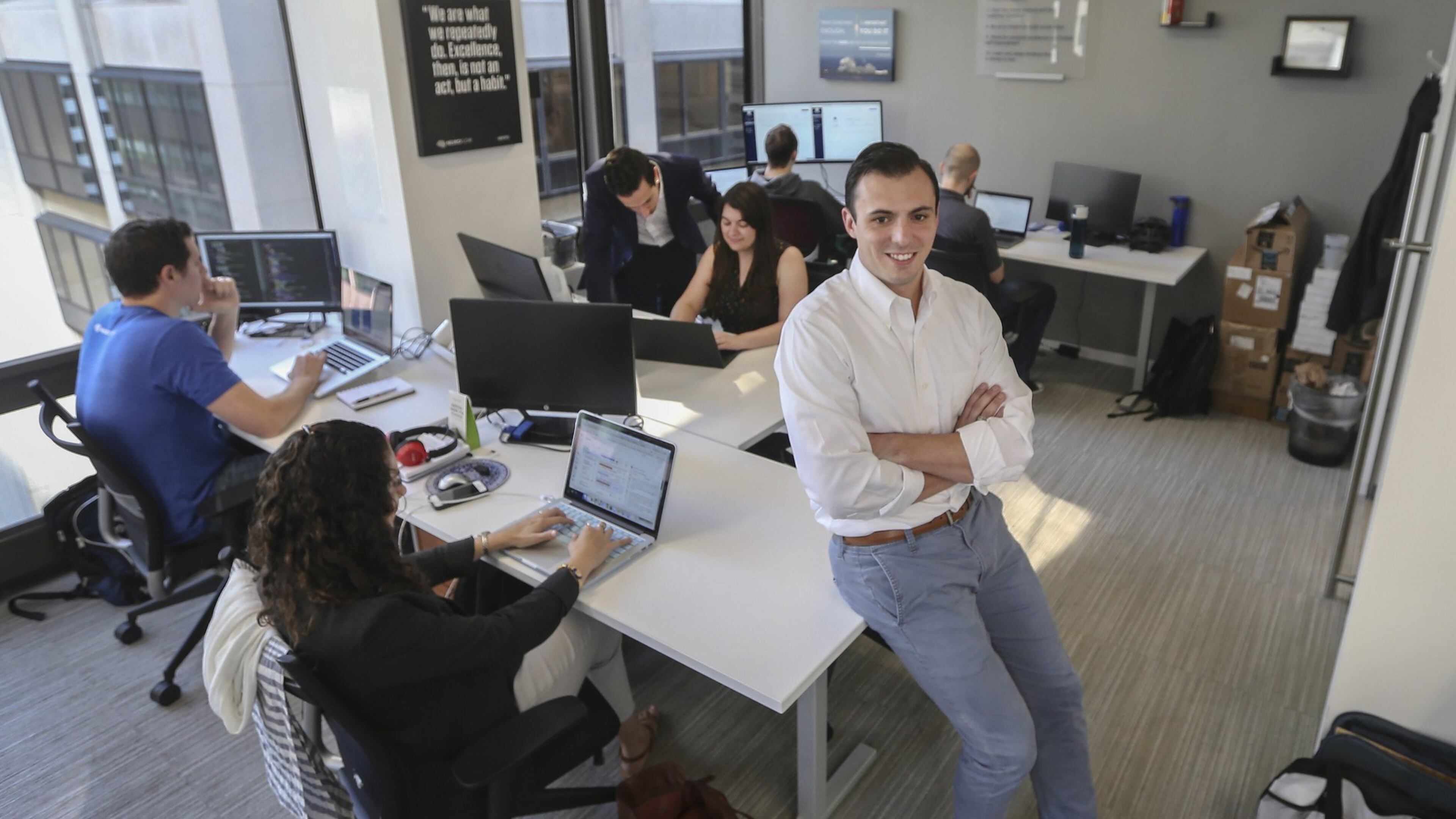 NeuroFlow CEO Christopher Molaro with some of his staff on Wednesday, Aug. 22, 2018 at Center City, Philadelphia, Pa. NeuroFlow is a software company that creates a platform for behavioral health professionals to monitor patient treatment compliance and progress. (Steven M. Falk/Philadelphia Inquirer/TNS)