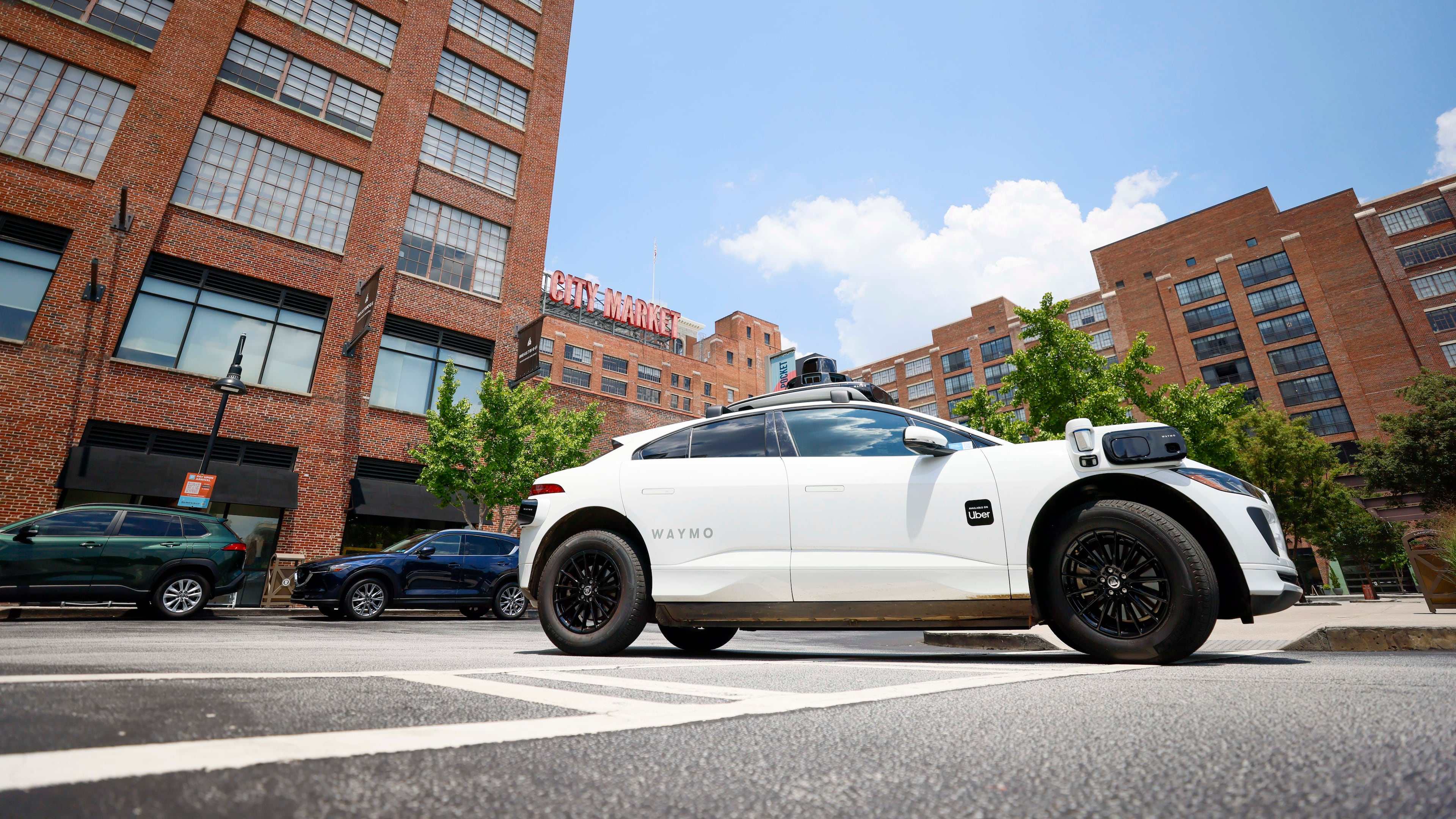 A self-driving Waymo vehicle is seen leaving Ponce City Market in Atlanta on Monday, June 23, 2025. Waymo is preparing to launch on the Uber app in Atlanta, utilizing the most advanced autonomous driving technology. (Miguel Martinez/AJC)